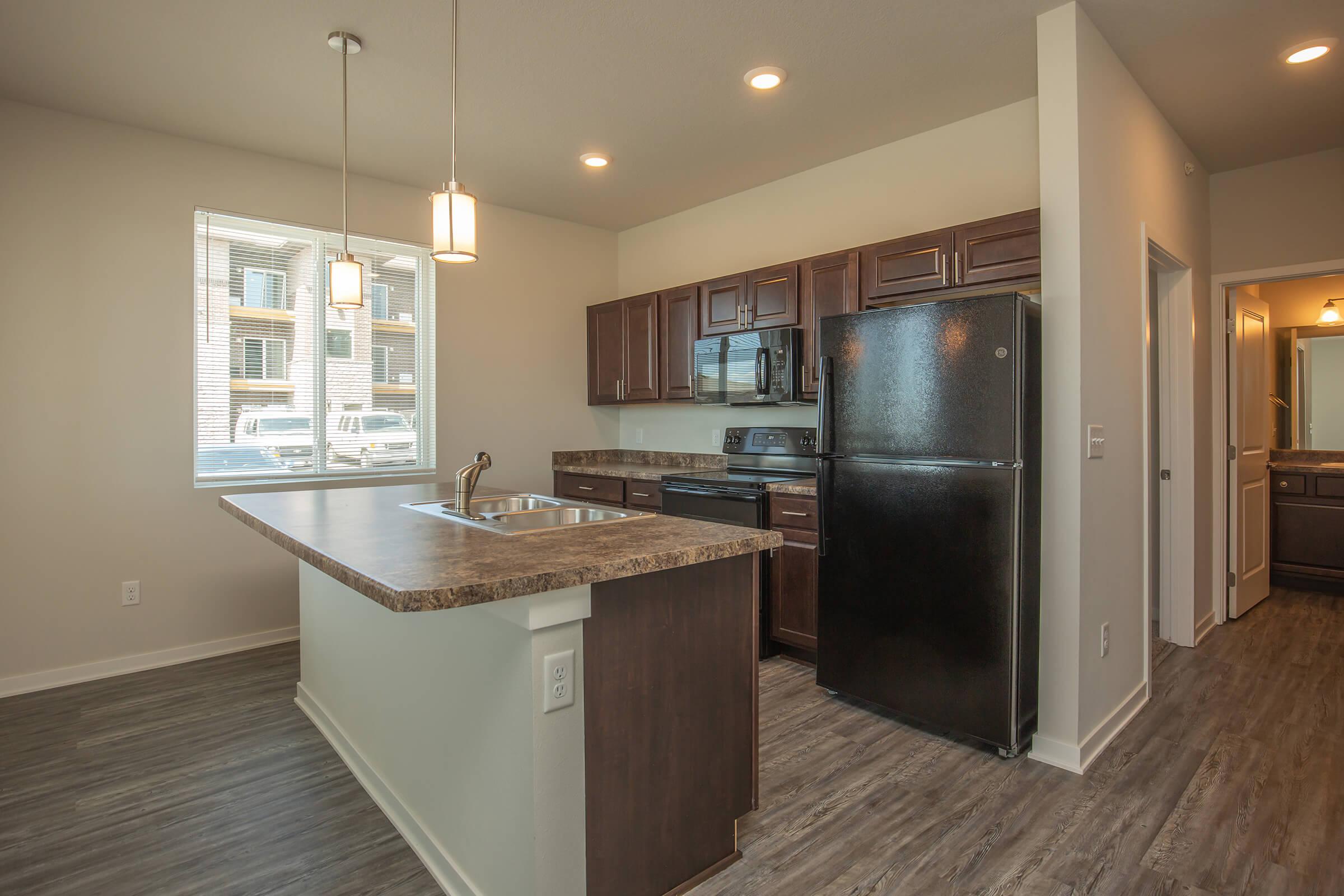 a kitchen with a wood floor