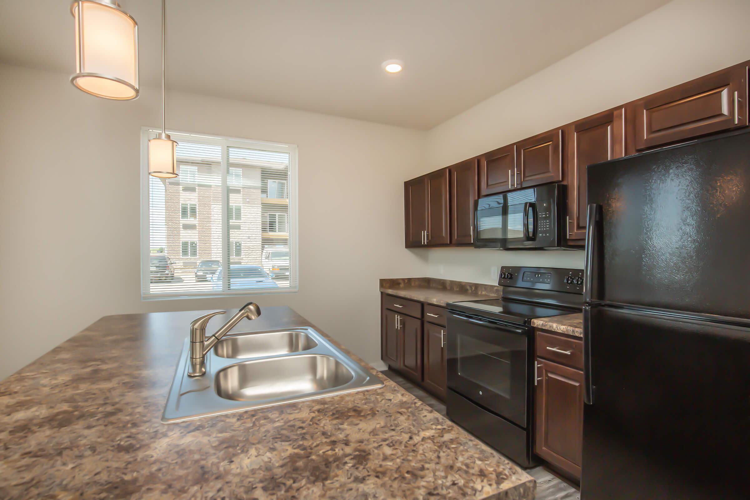 a modern kitchen with stainless steel appliances