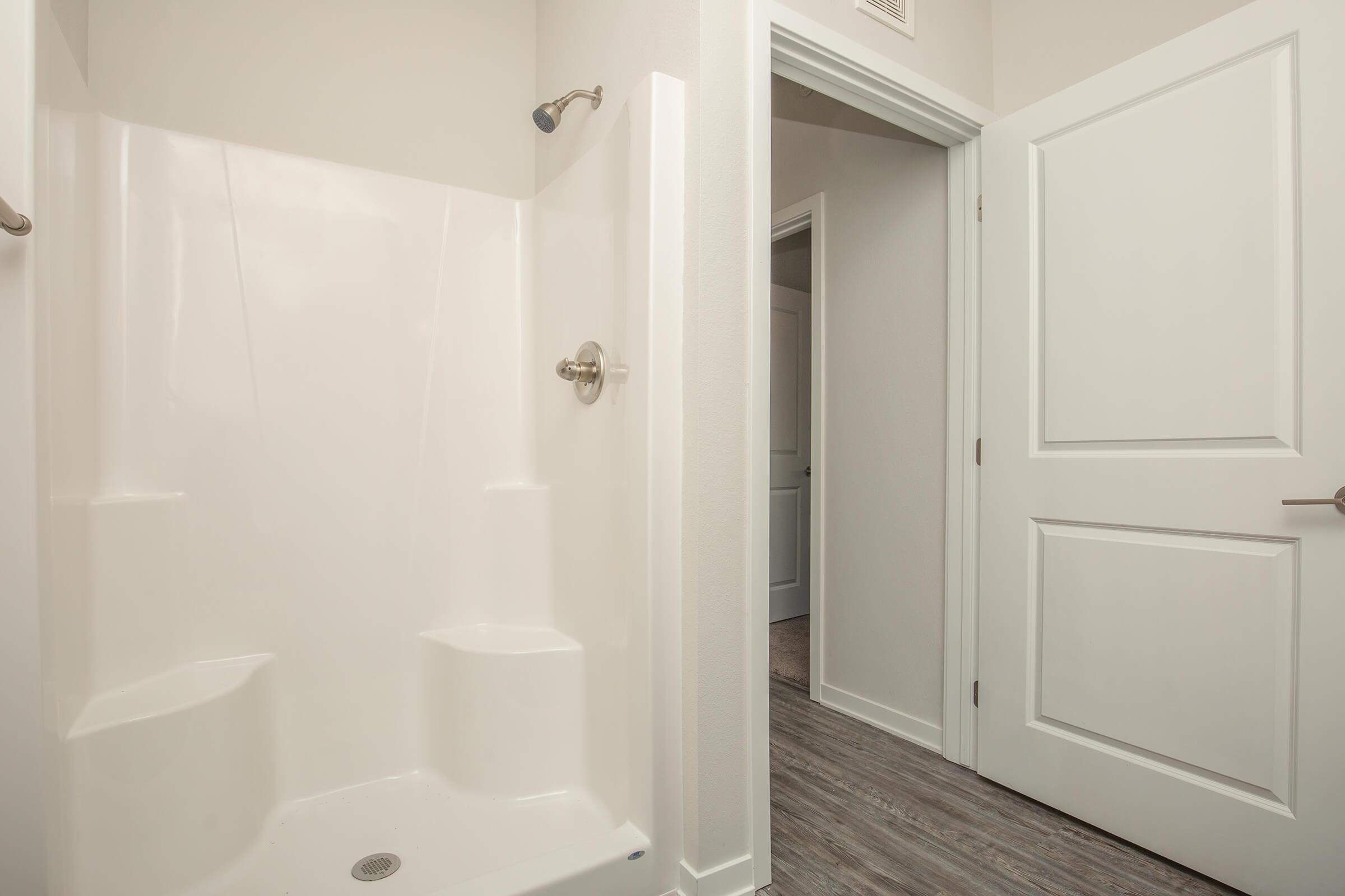 a white sink sitting next to a door