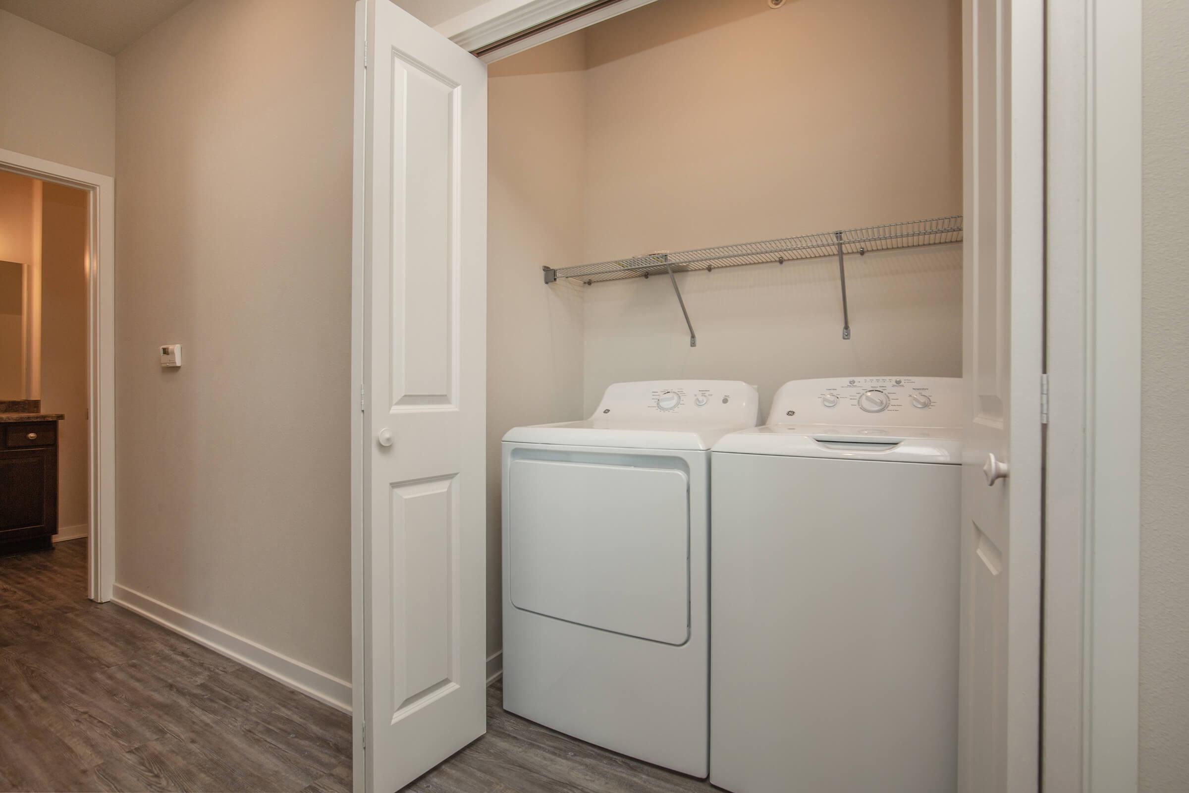 a white sink sitting next to a door