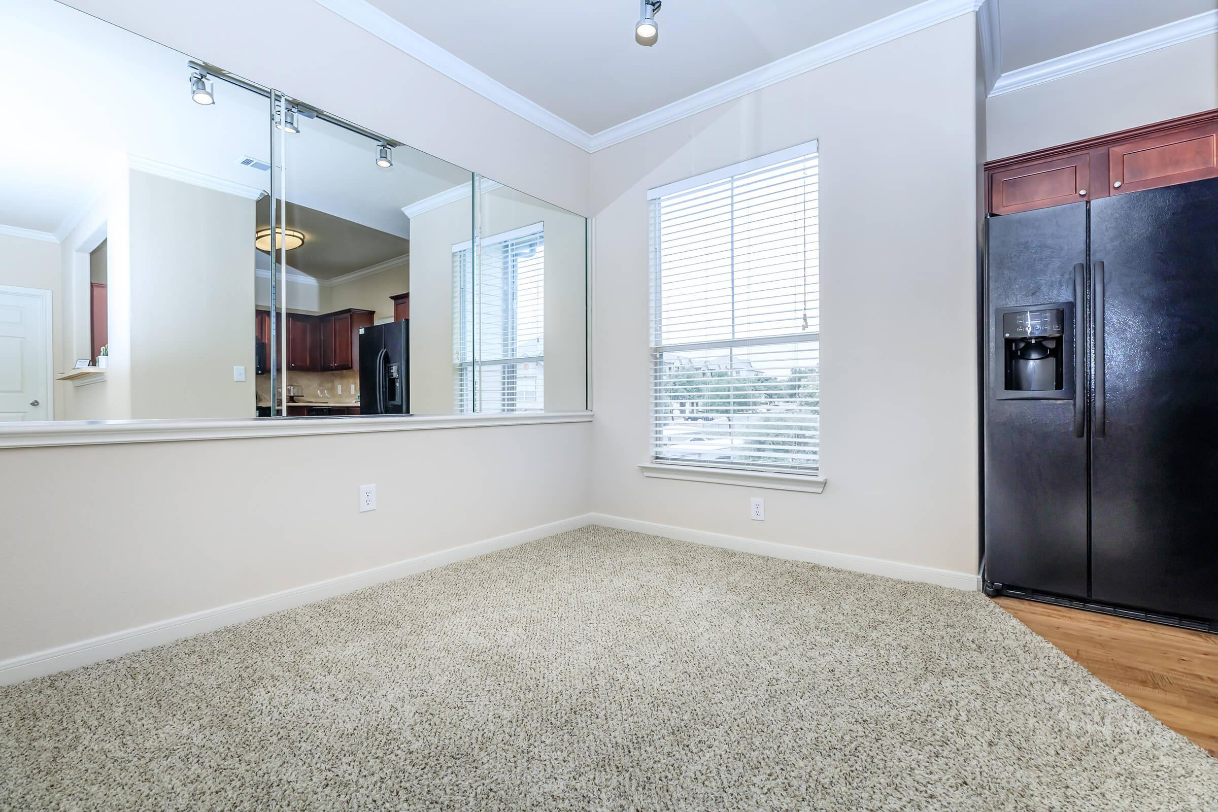 a bedroom with a large window