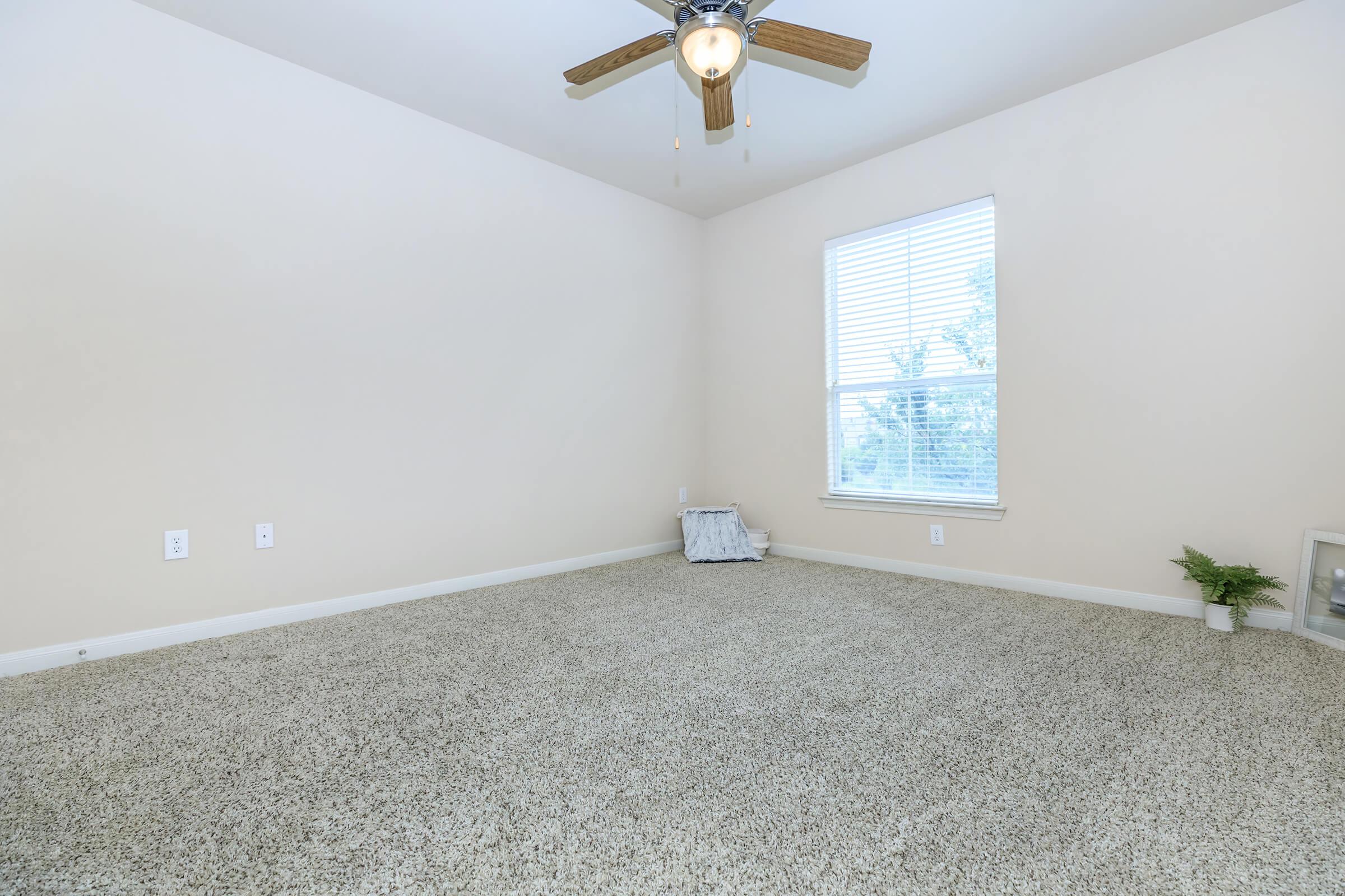 a bedroom with a large window