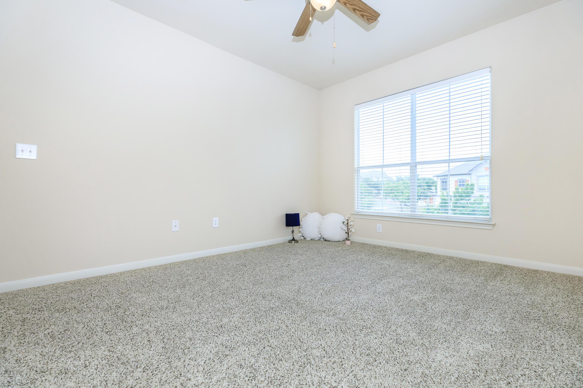 a bedroom with a large window