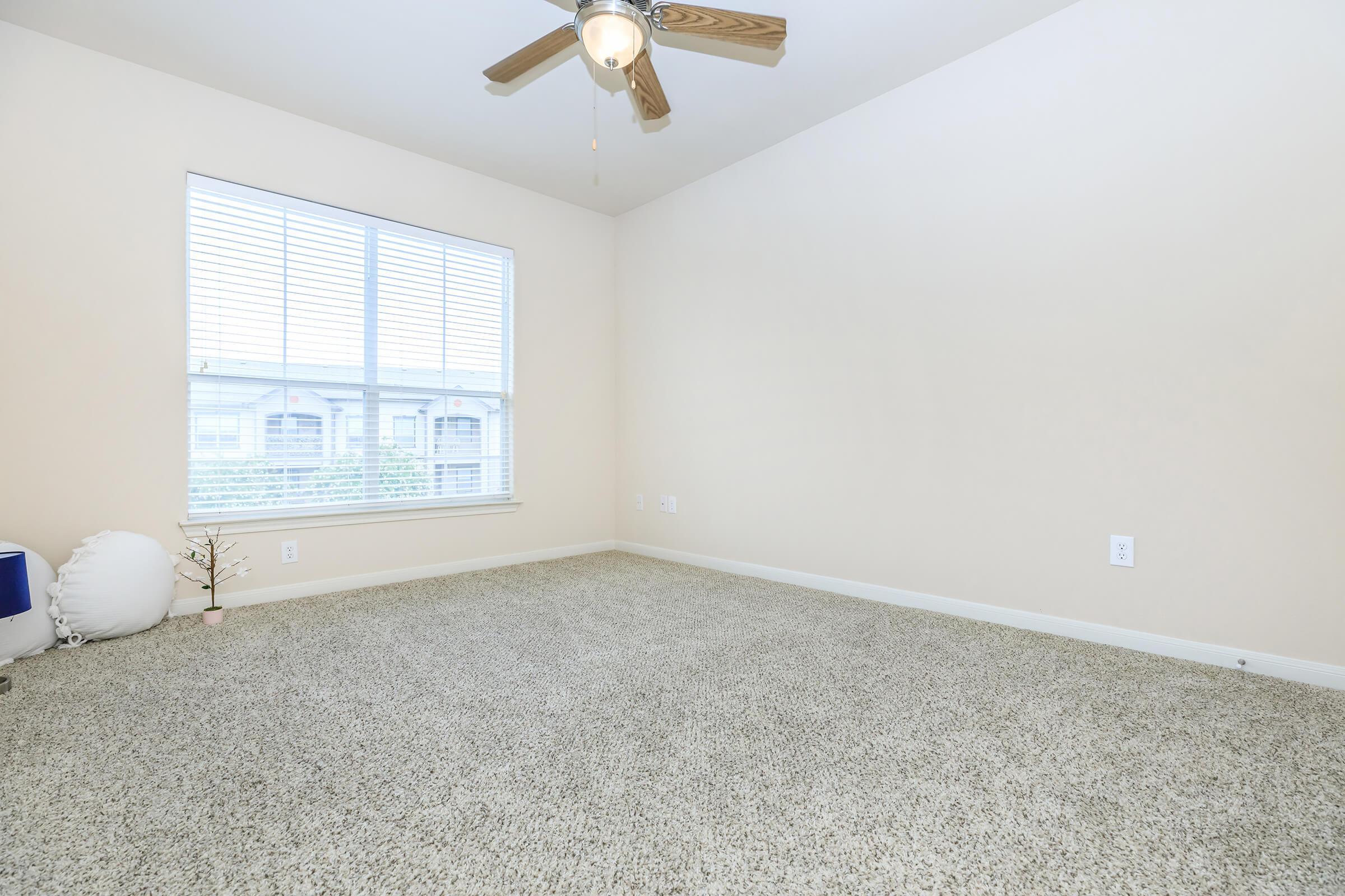 a bedroom with a large window