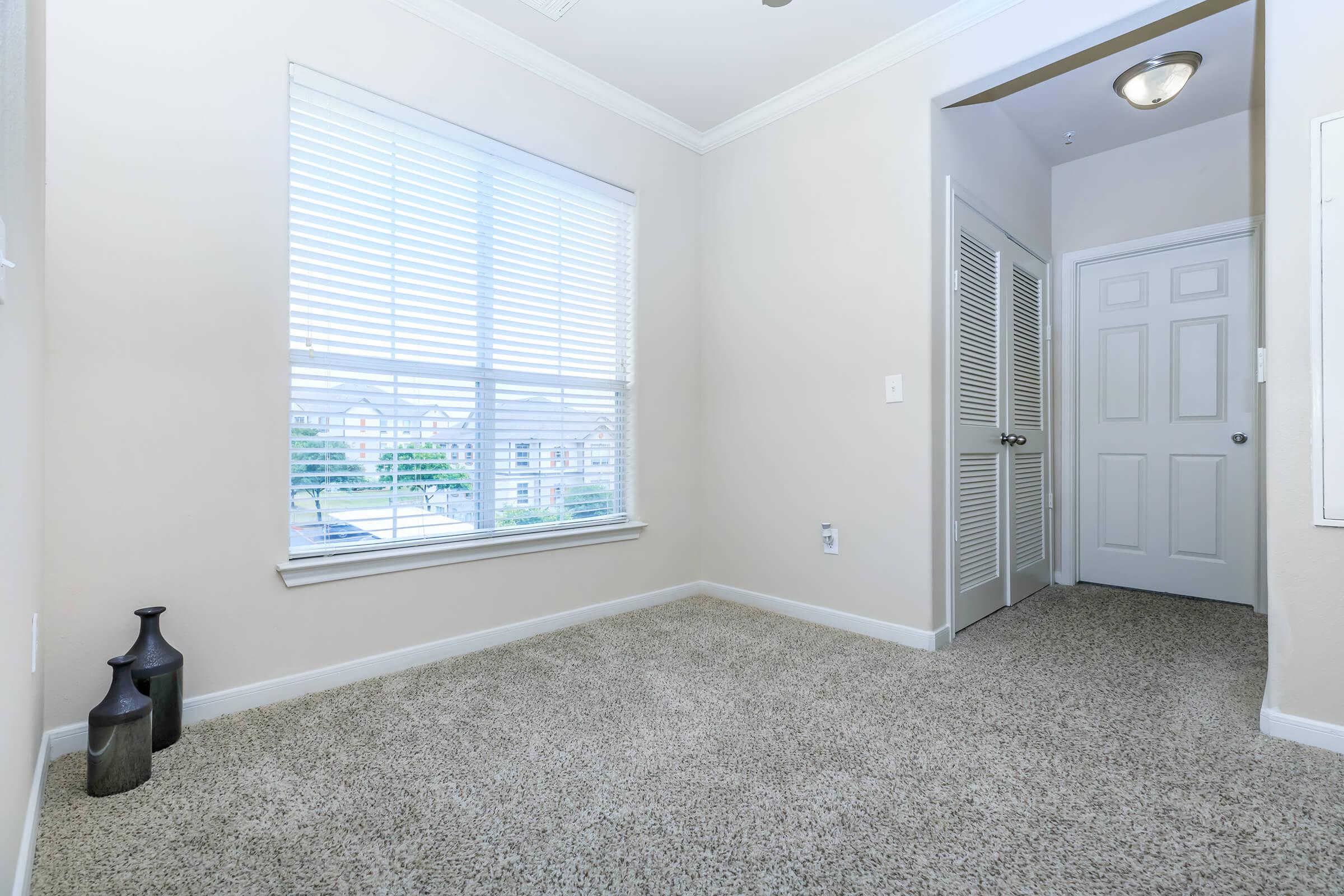 a room with a sink and a window