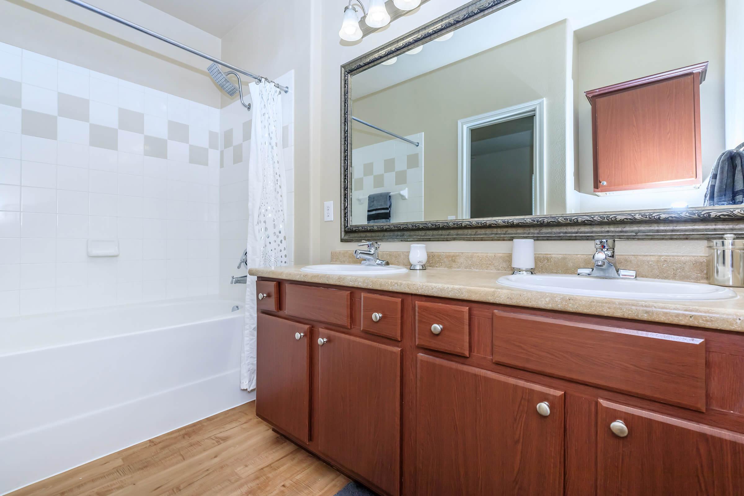 a kitchen with a sink and a mirror