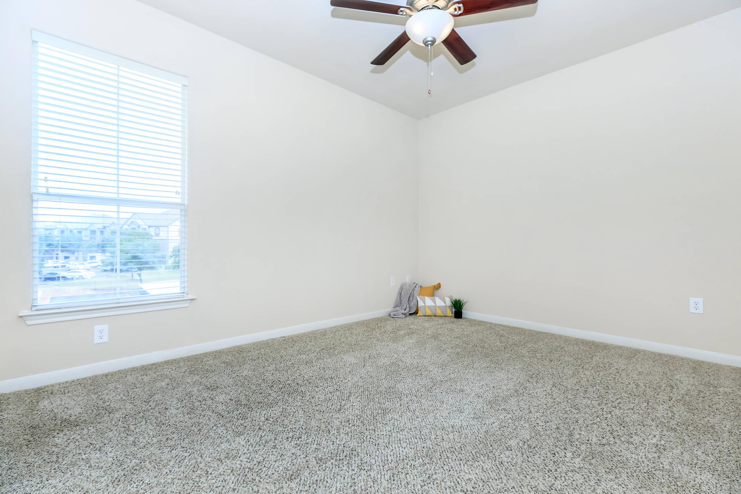 a bedroom with a large window
