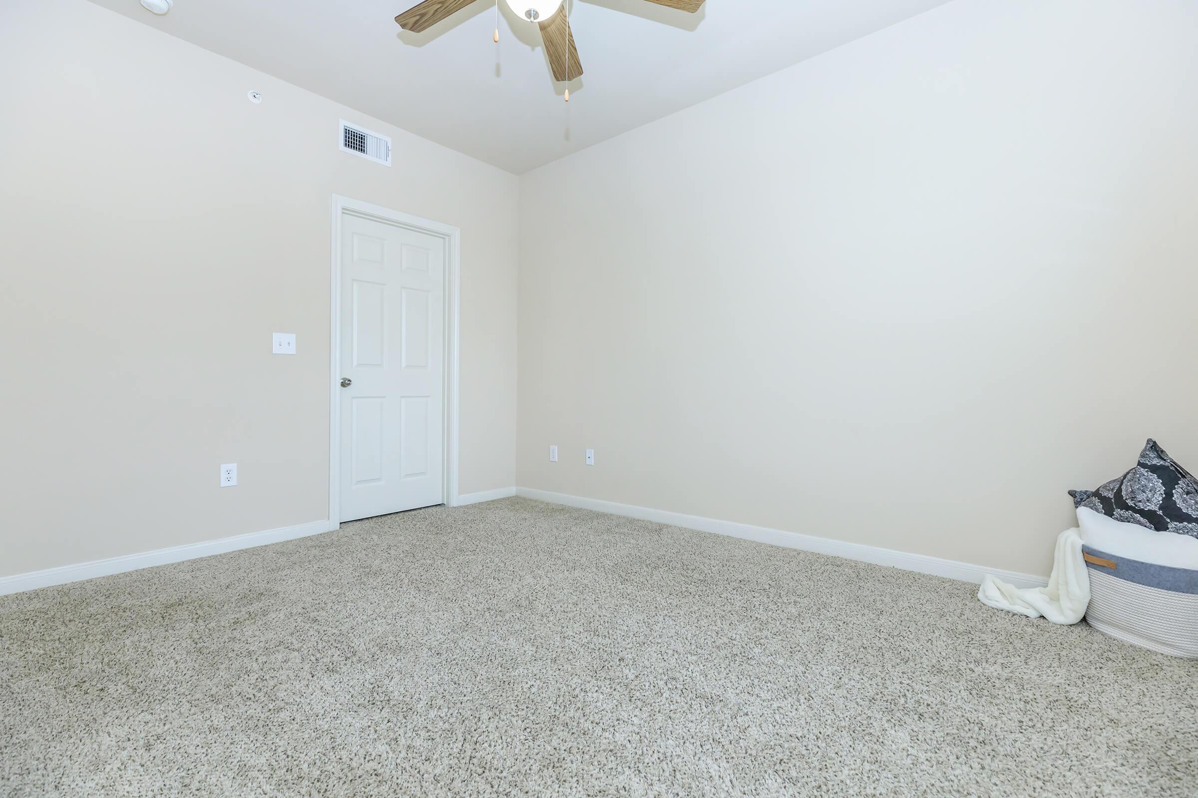 a bedroom with a bed in a room