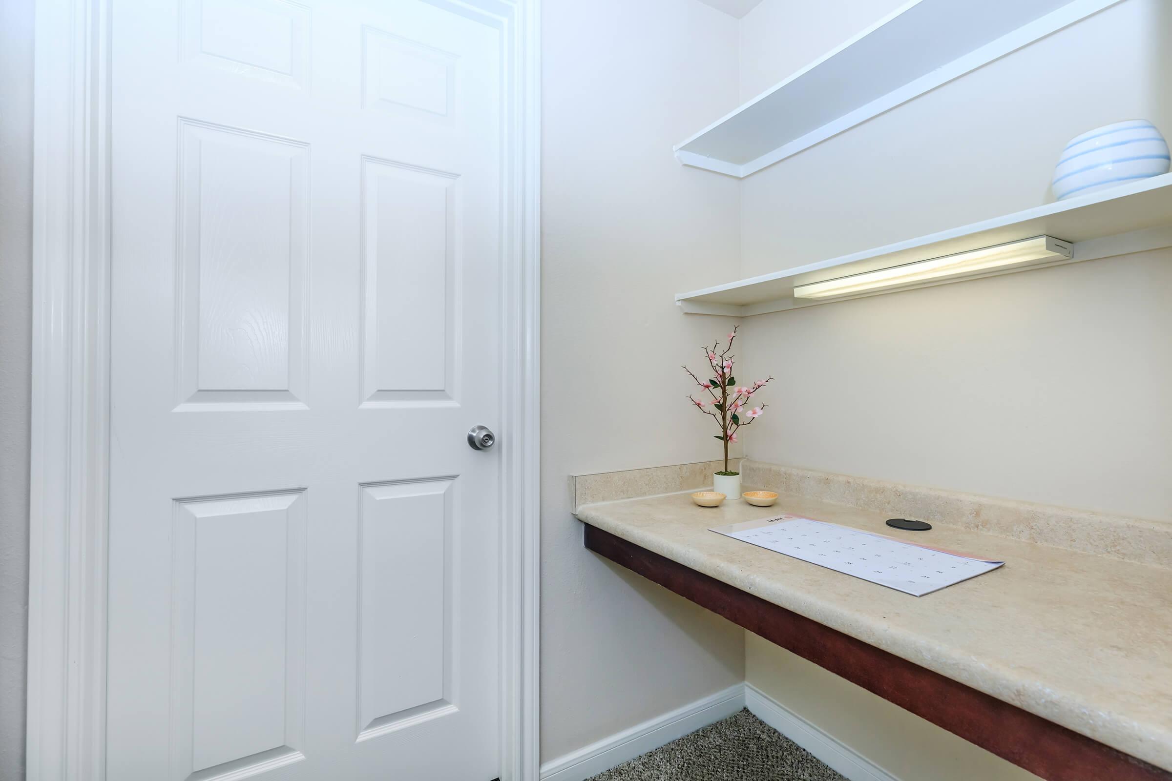 a room with a sink and a mirror