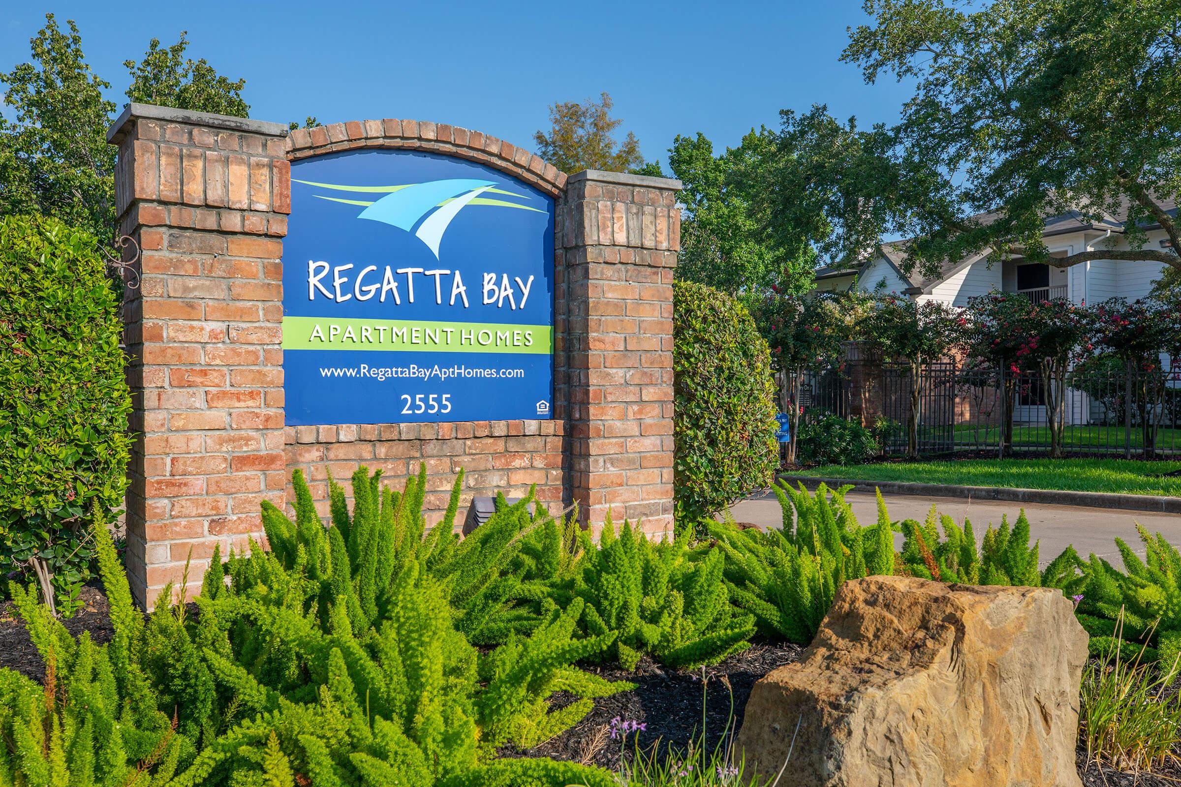 a sign in front of a brick building