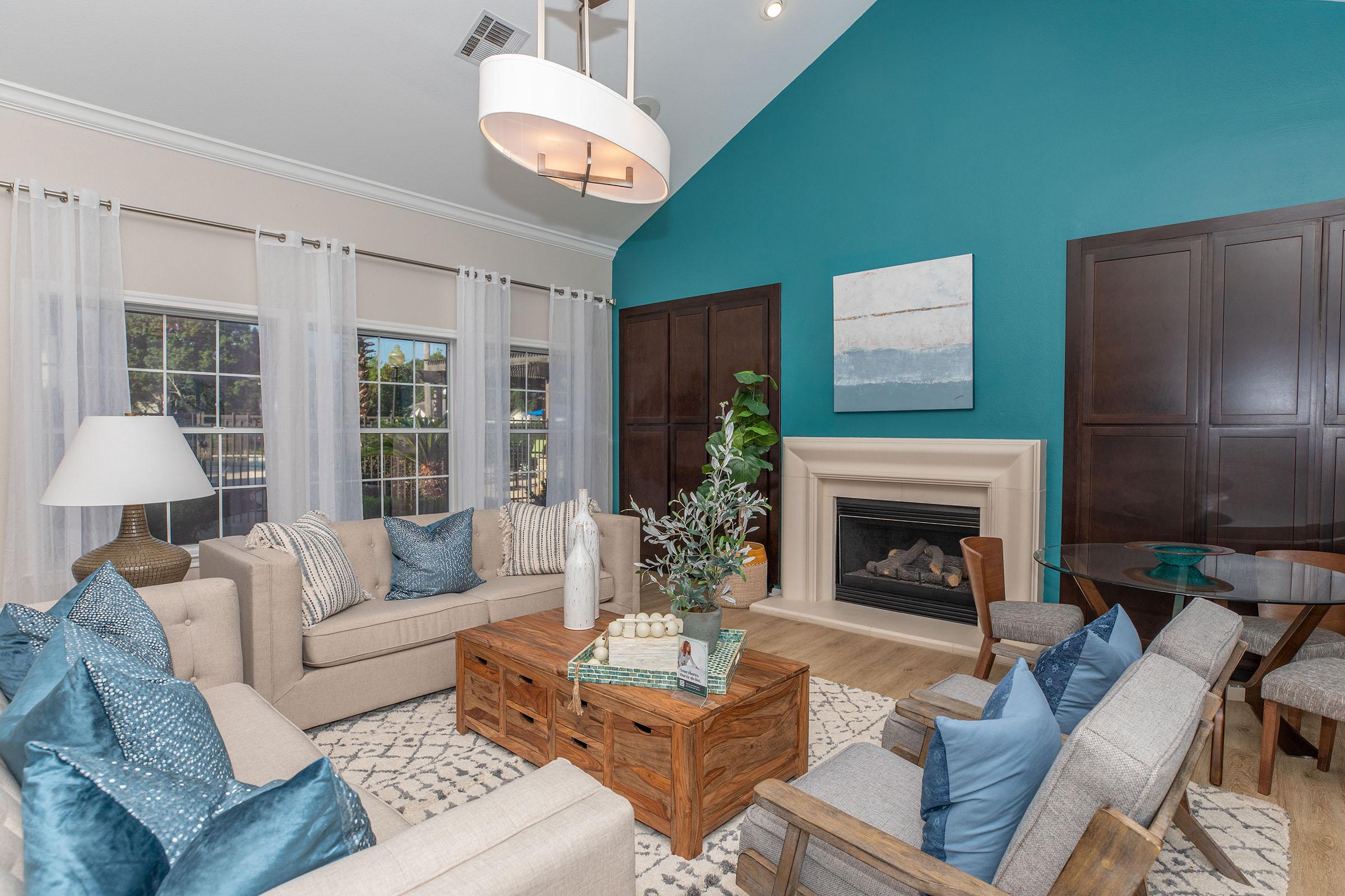 a living room filled with furniture and a large window