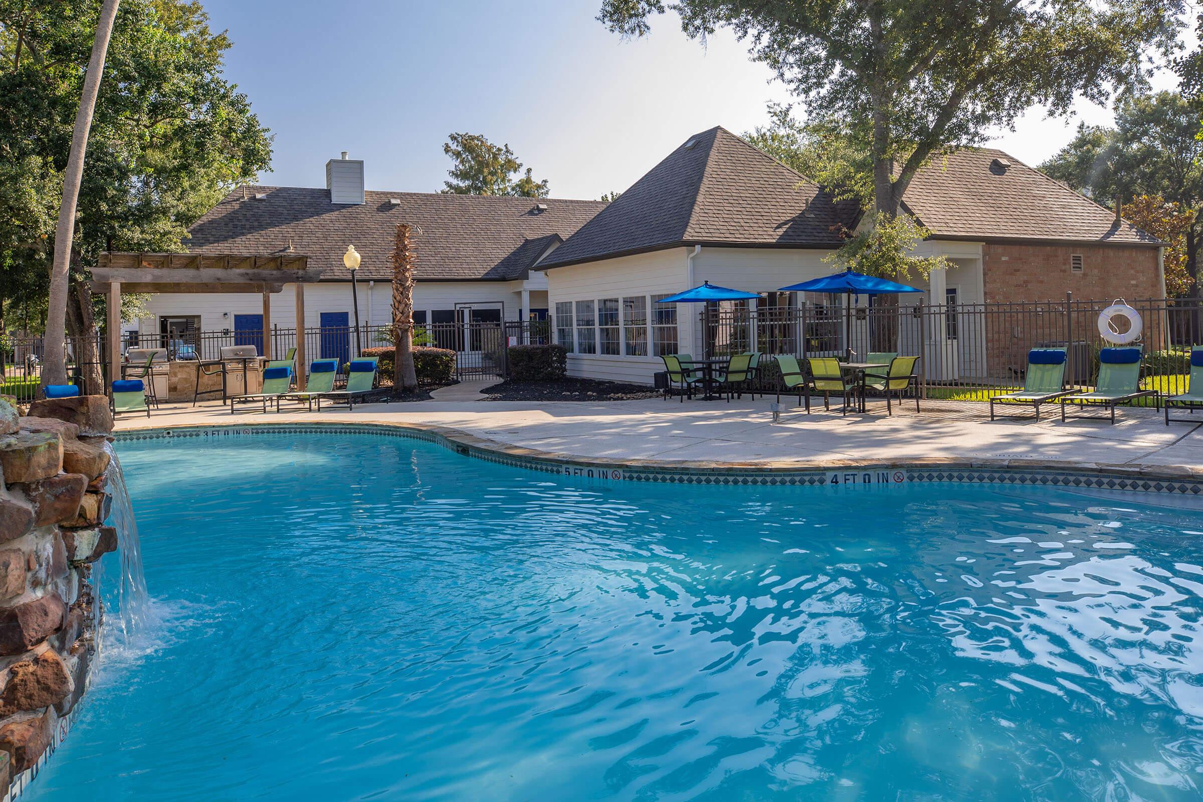 a large pool of water in front of a house