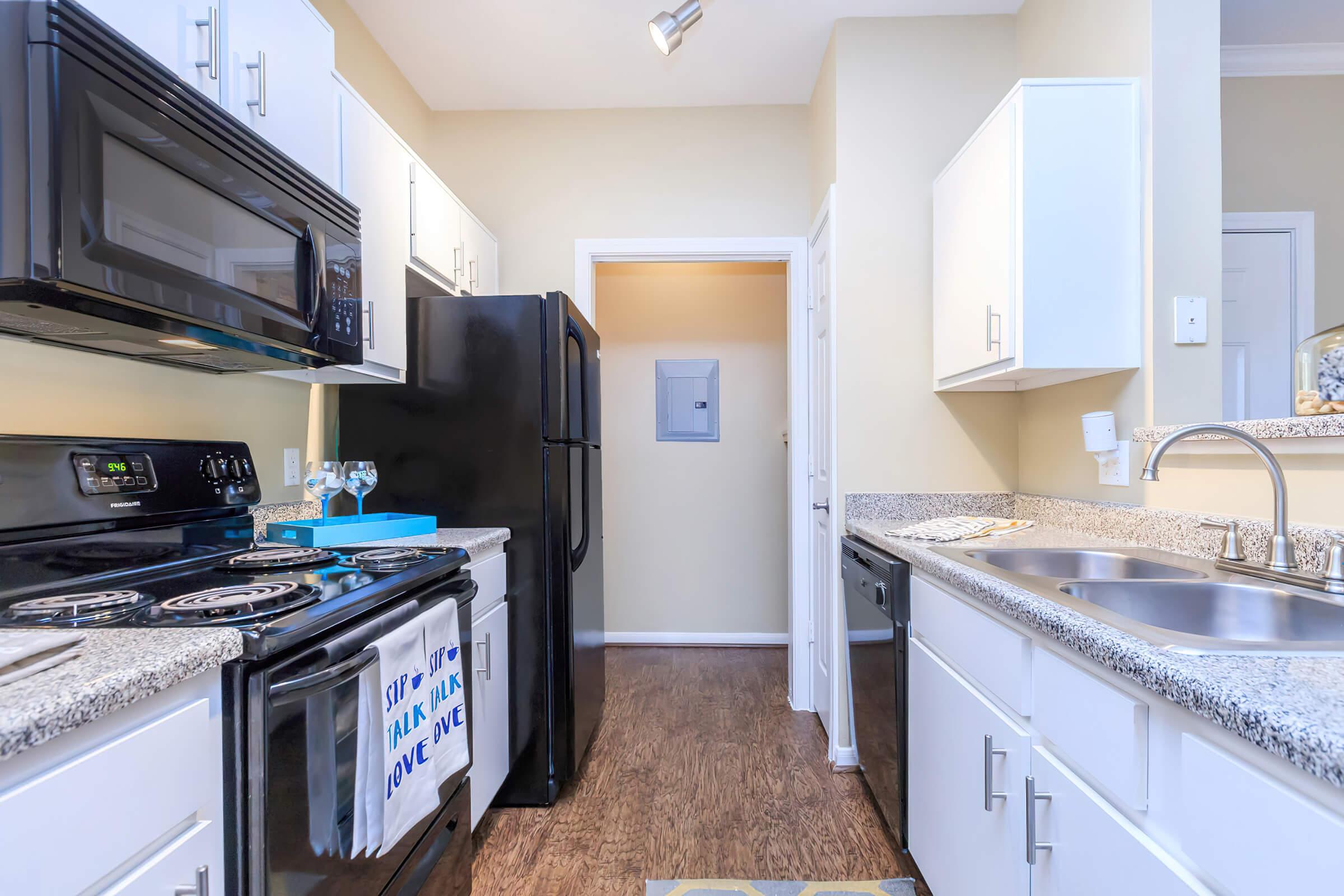 a kitchen with a stove top oven