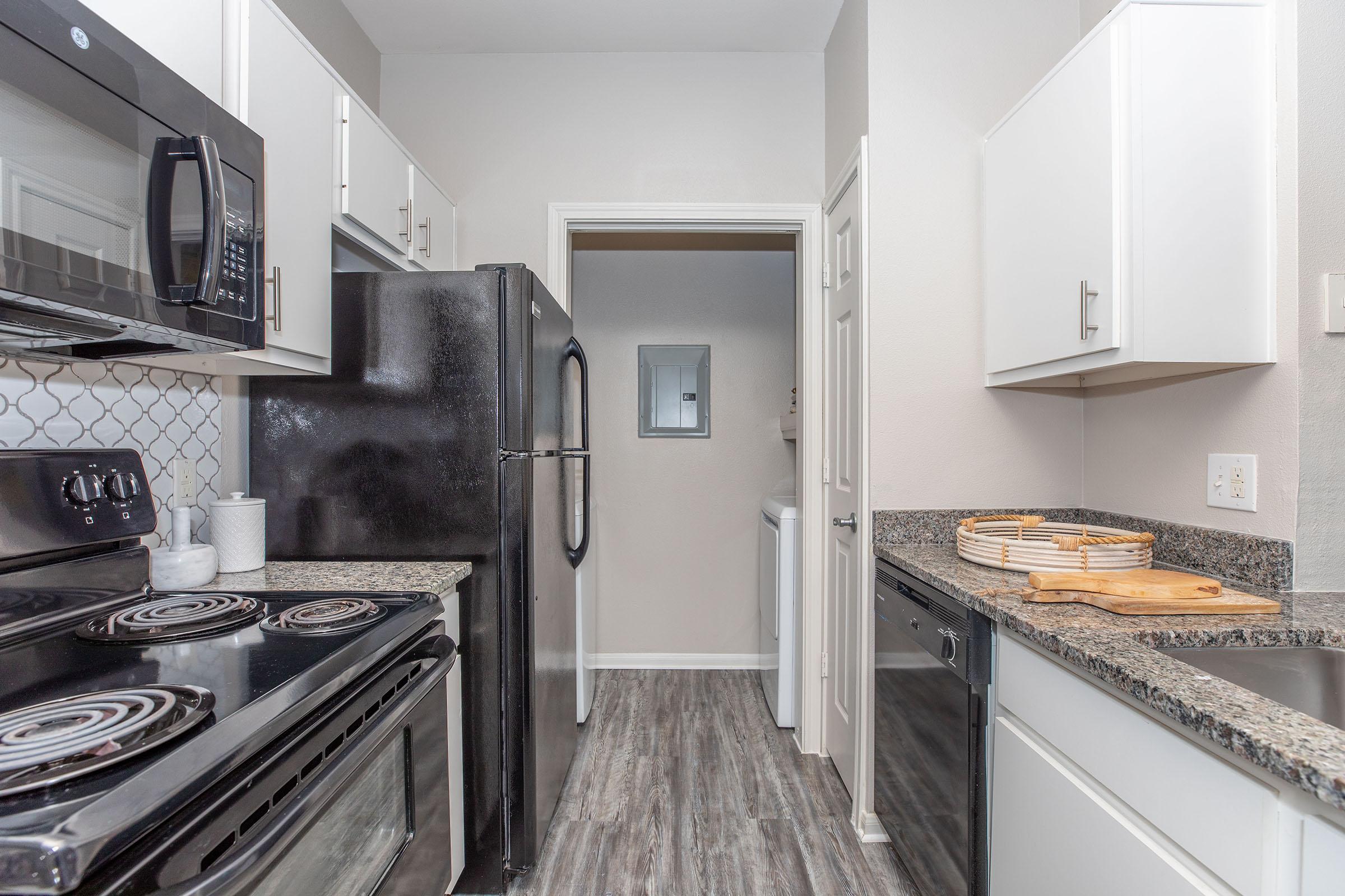 a kitchen with a stove and a sink