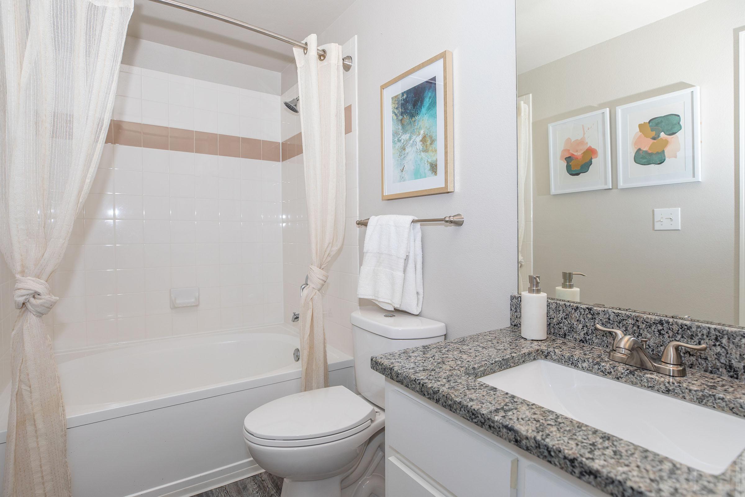 a room with a sink and a bath tub