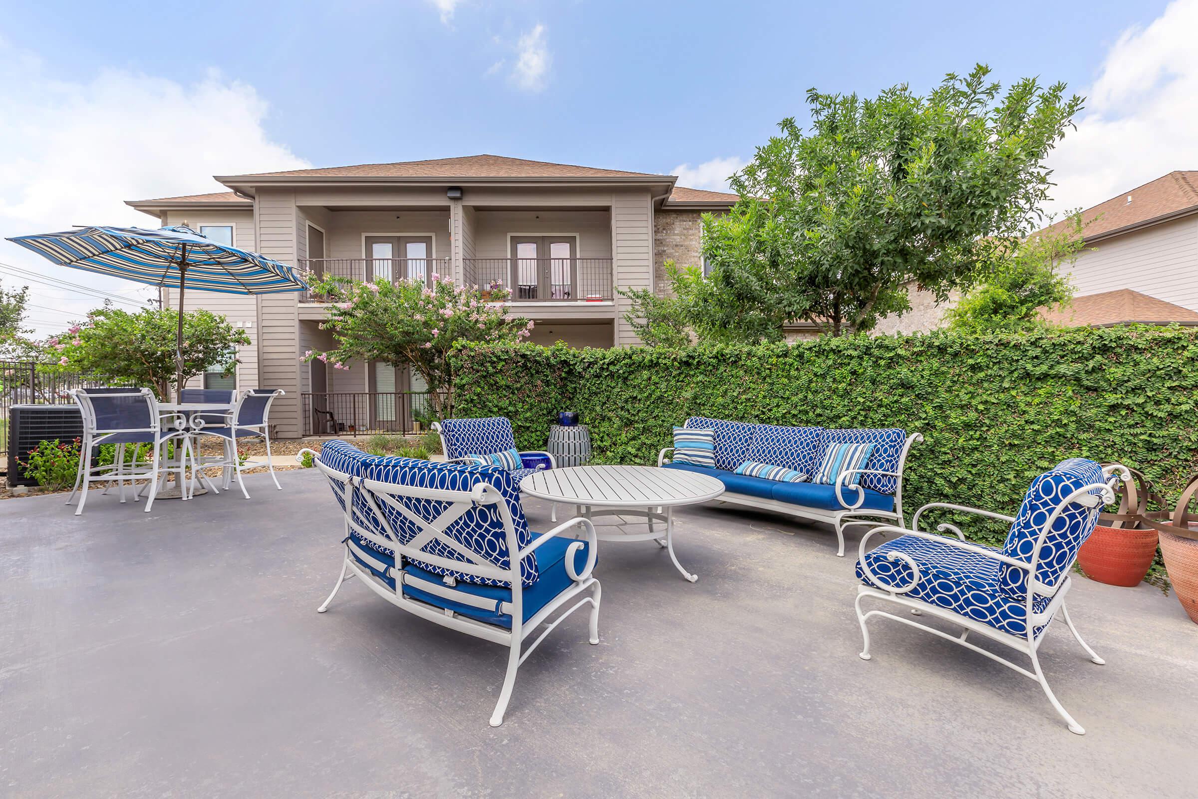 a blue bench in front of a house