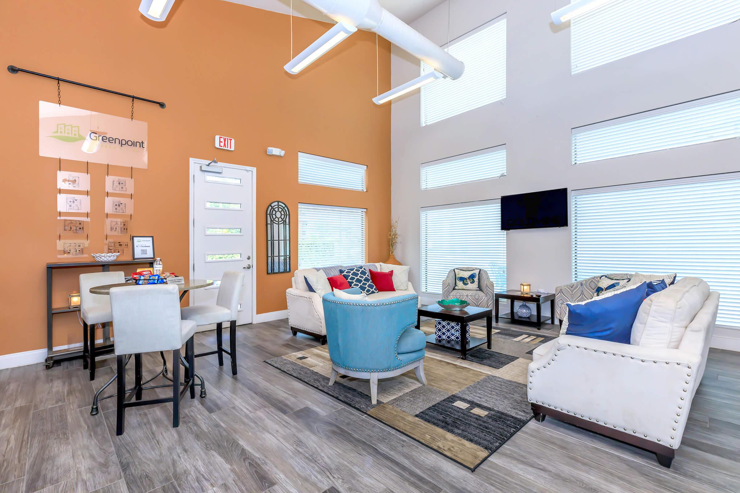 a room filled with furniture and a large window