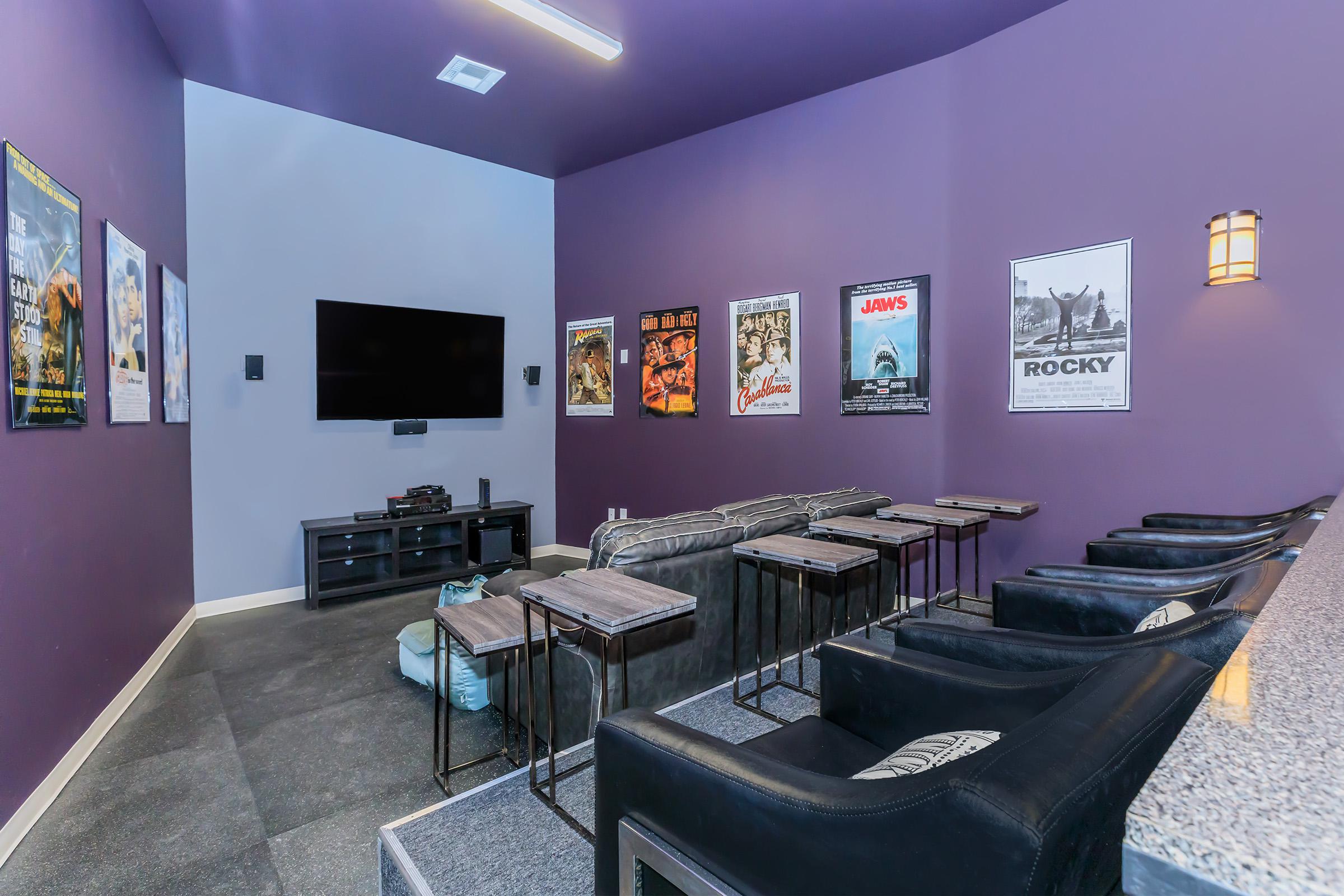a room filled with furniture and a flat screen tv