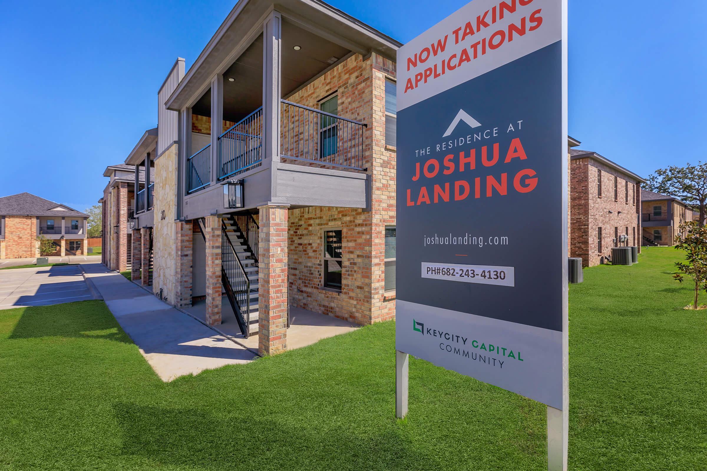 a house that has a sign on the side of a building