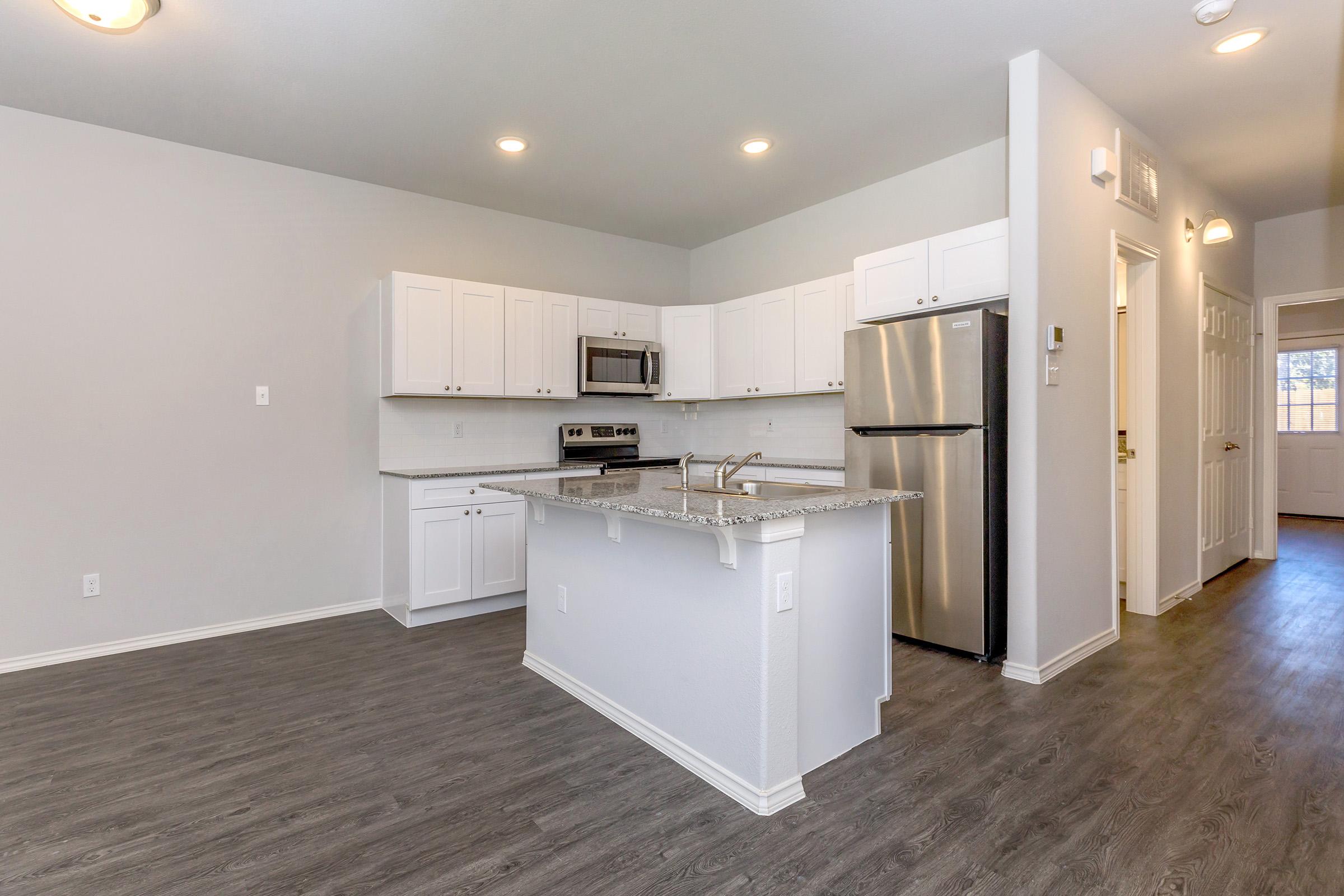 a kitchen with a wooden floor