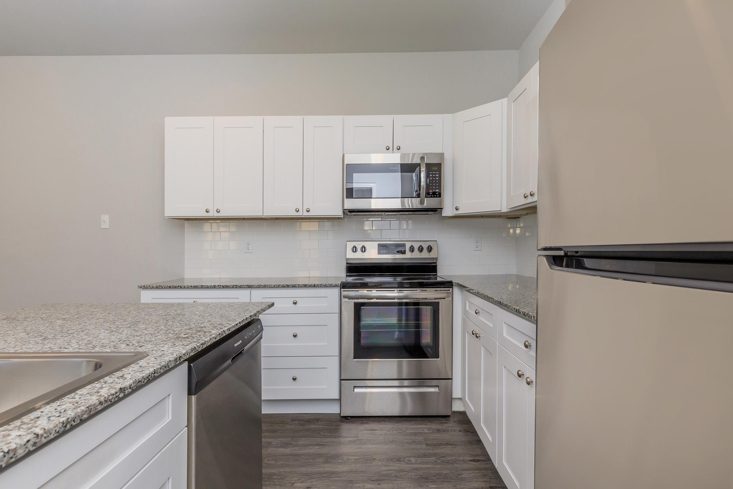 a kitchen with a stove top oven