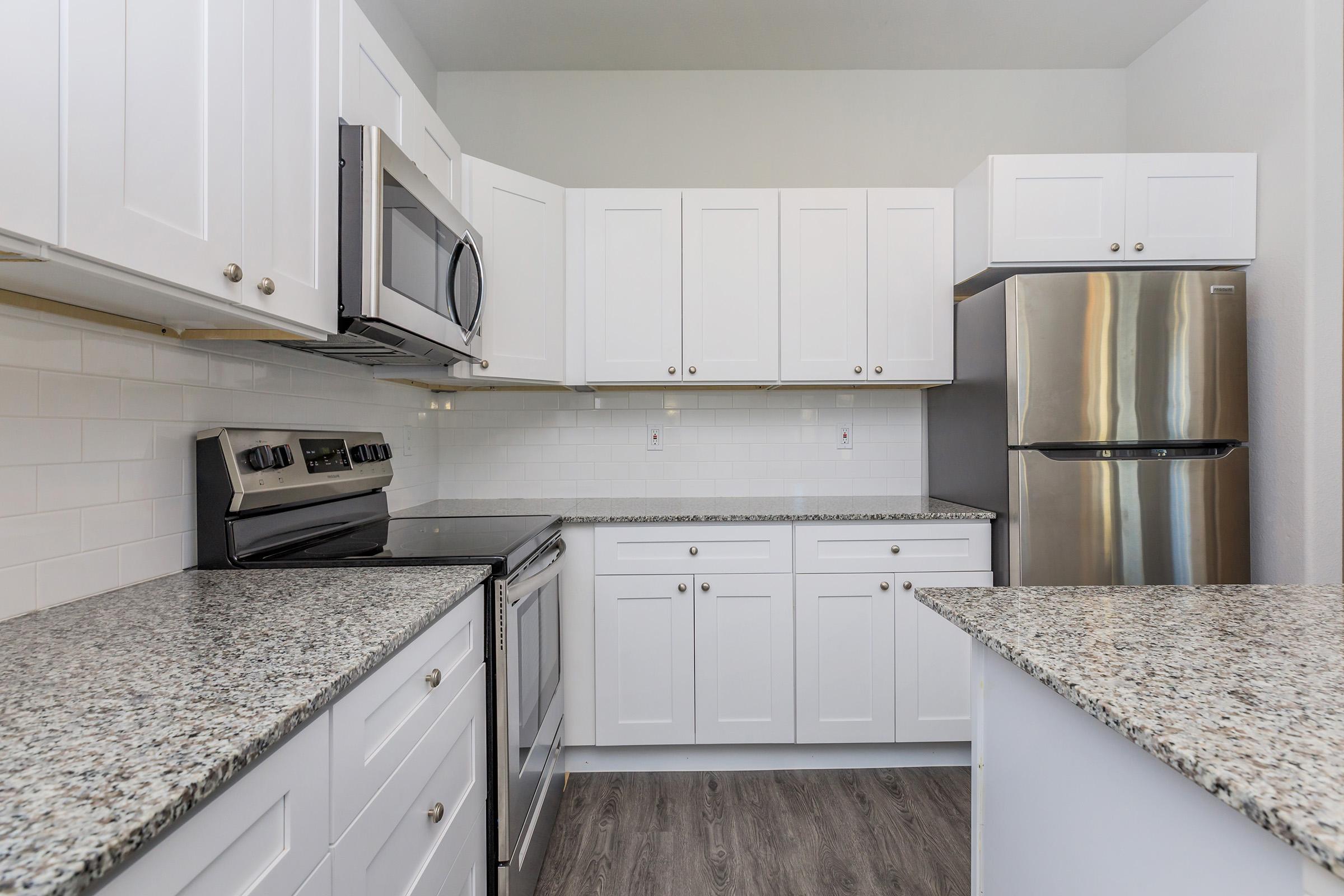 a kitchen with a sink and a microwave