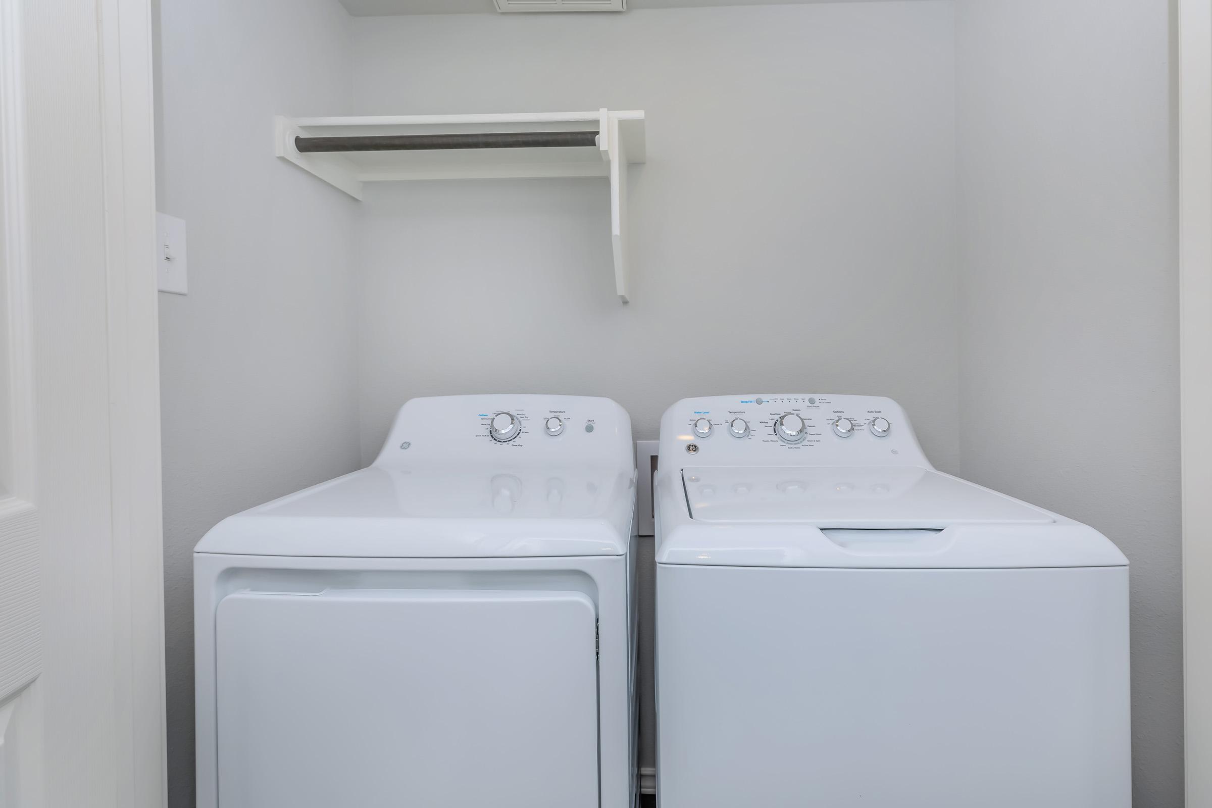 a refrigerator freezer sitting next to a sink