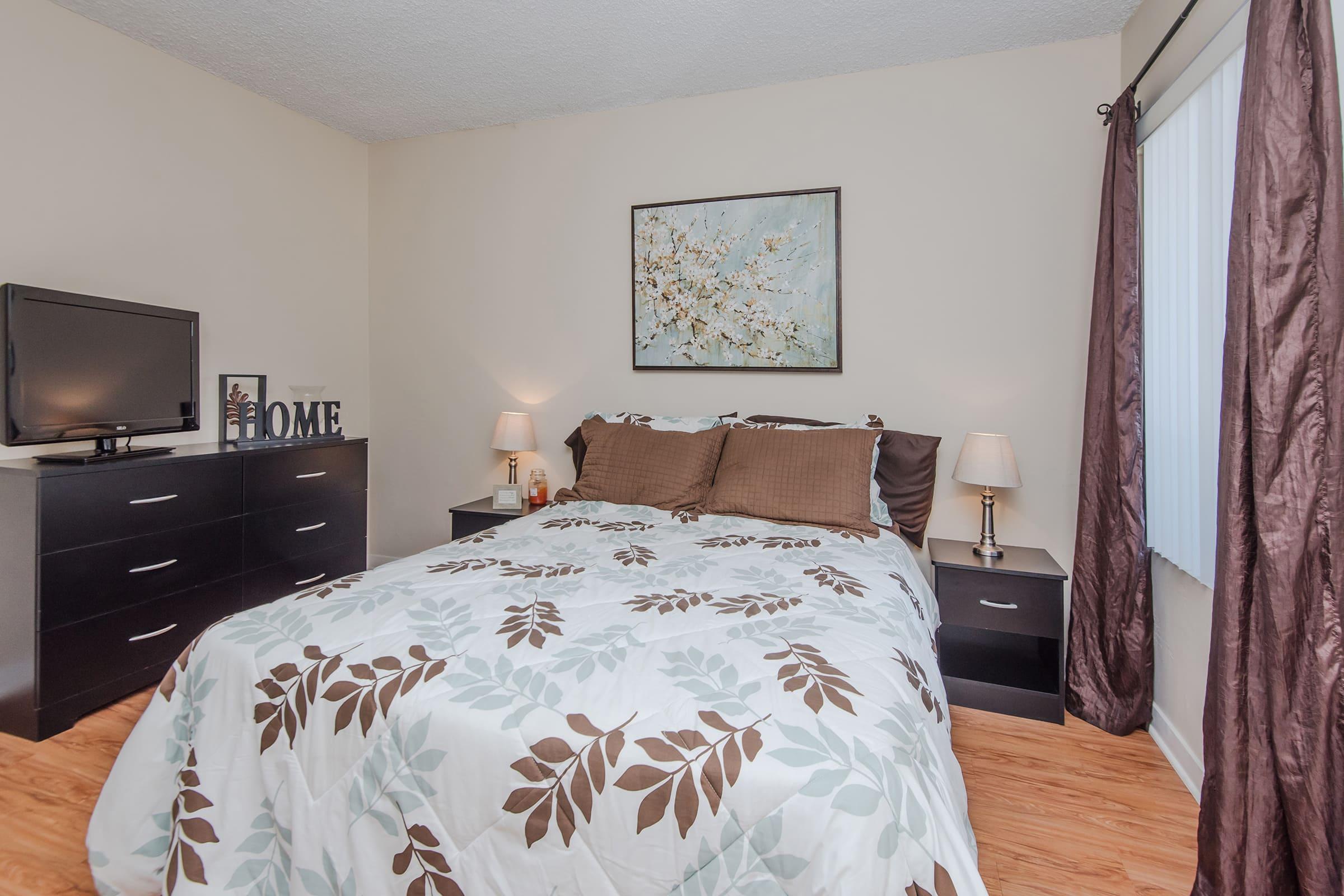 a bedroom with a bed and dresser