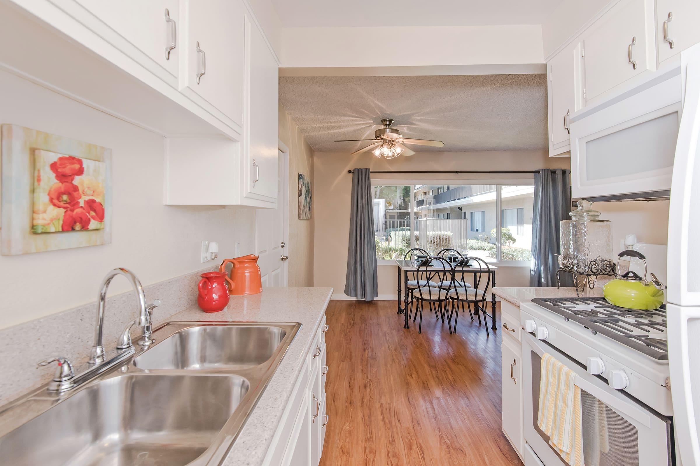 a kitchen with white appliances