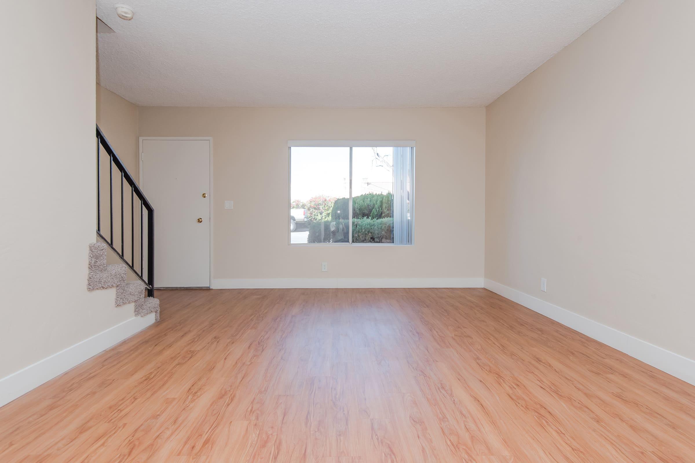 a close up of hard wood floors and a staircase