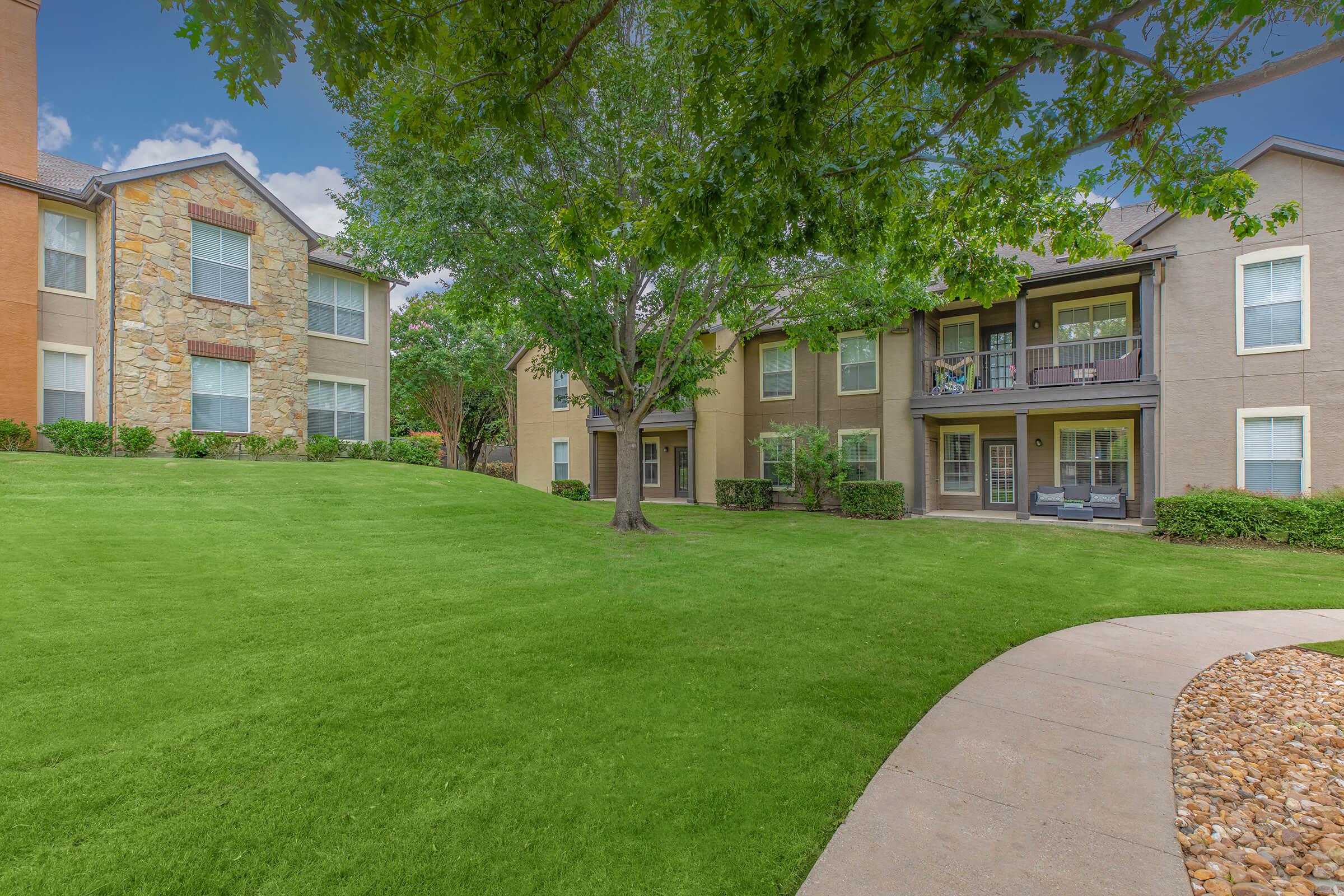 the community buildings with green bushes