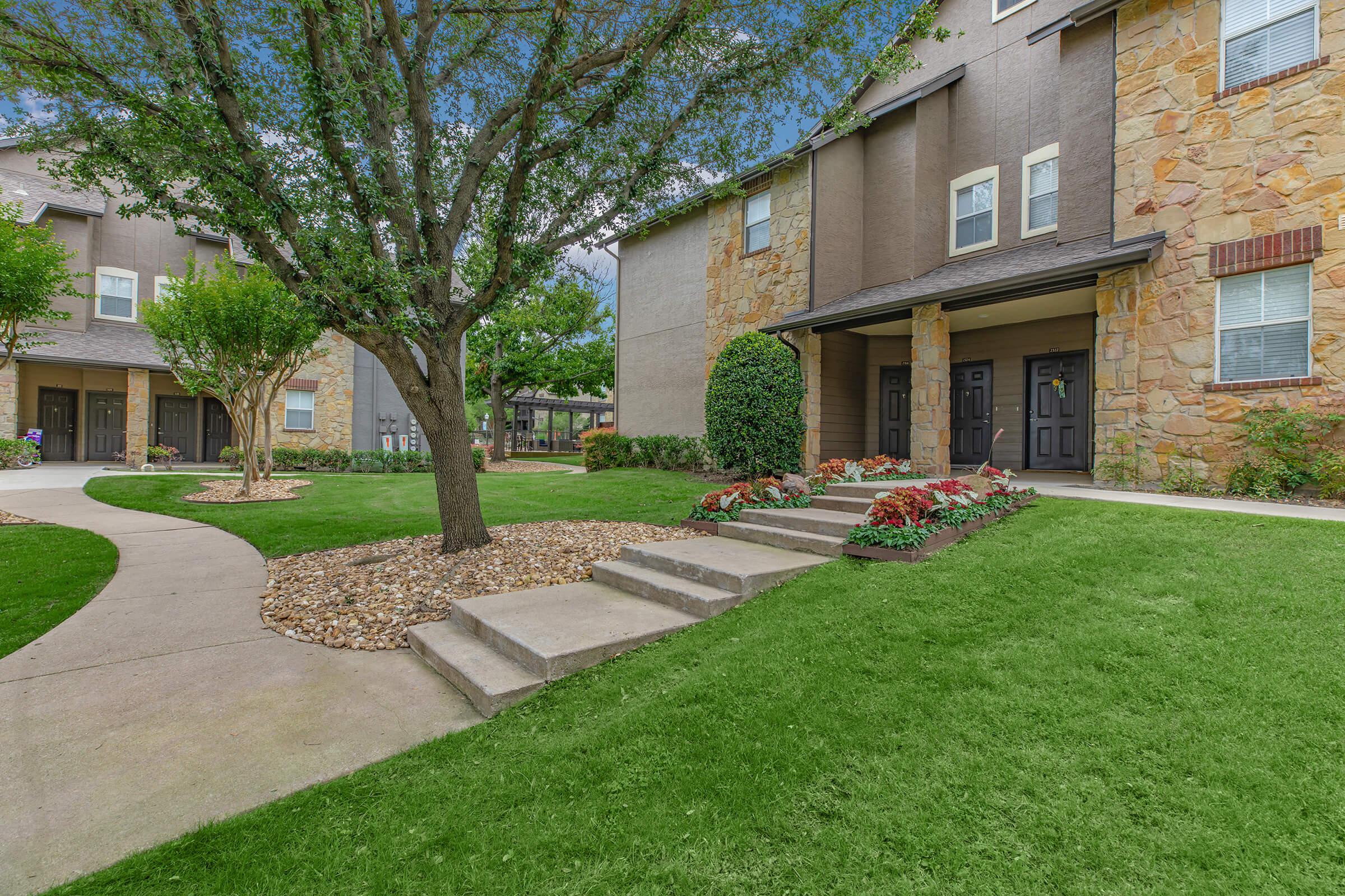 the community buildings with green grass