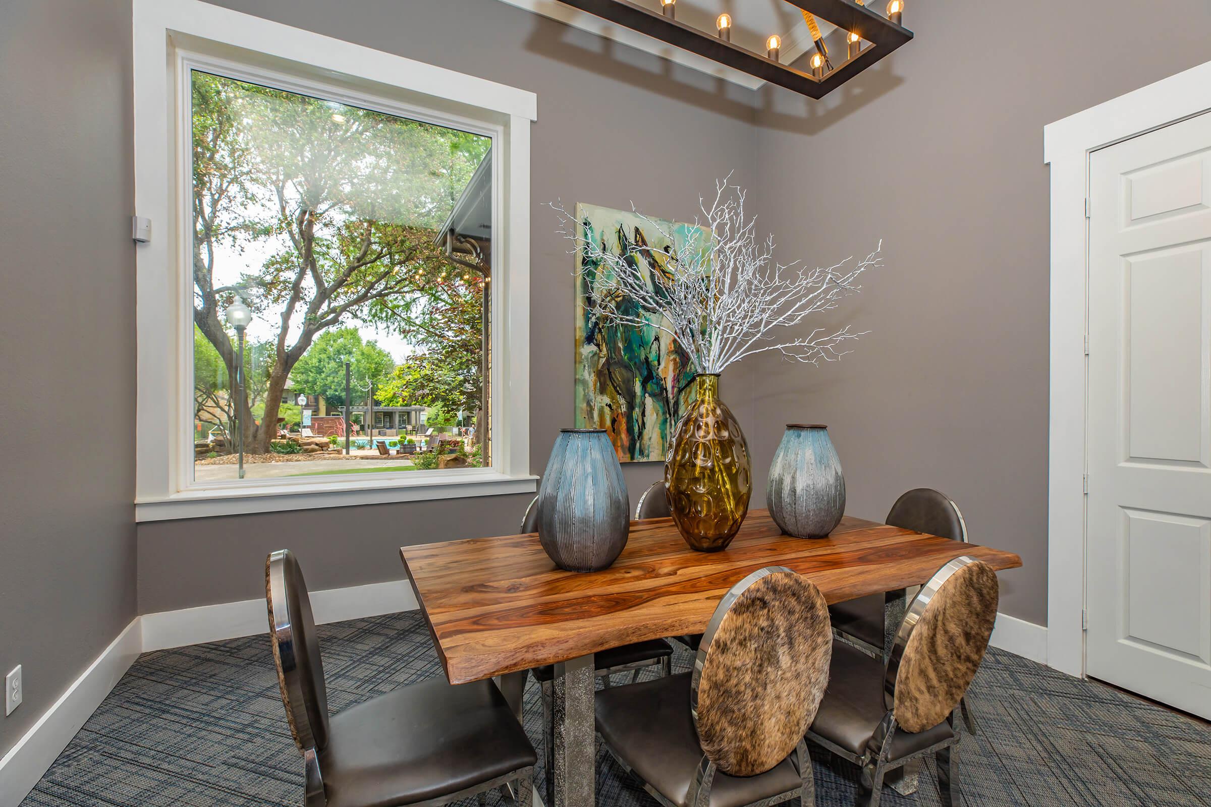 a community room with a wooden table