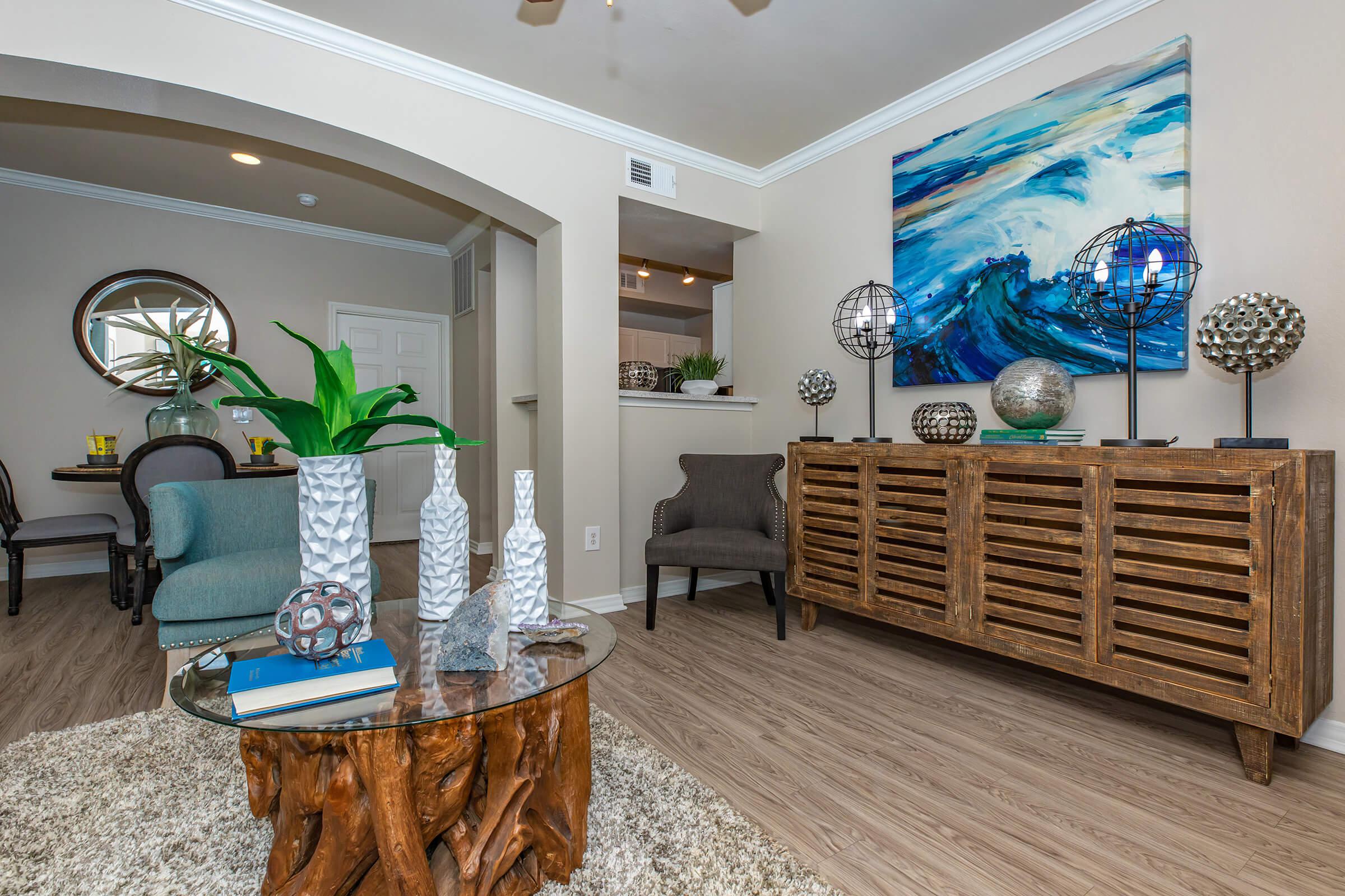 a living room with a wooden dresser