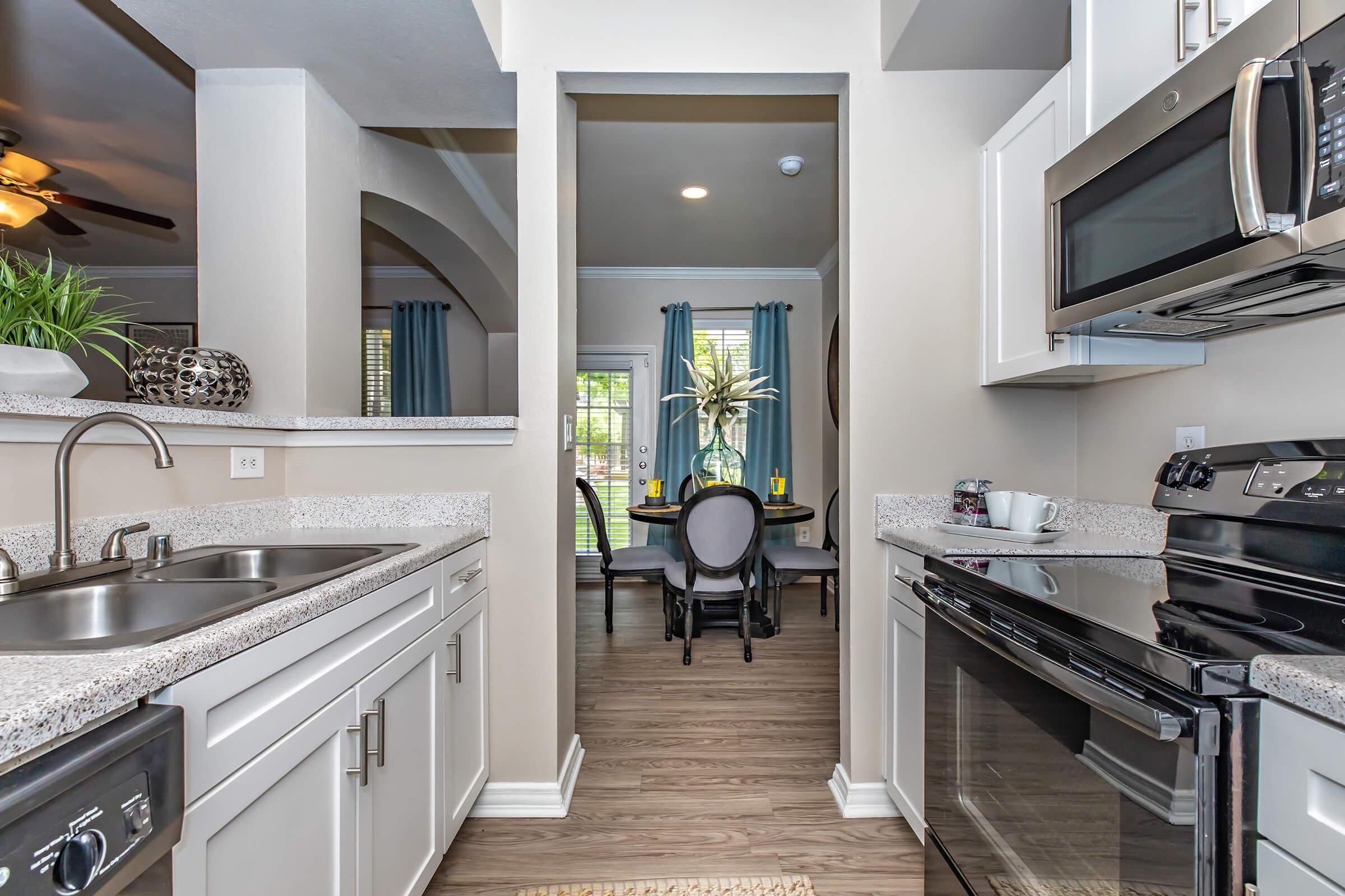 a kitchen with stainless steel appliances