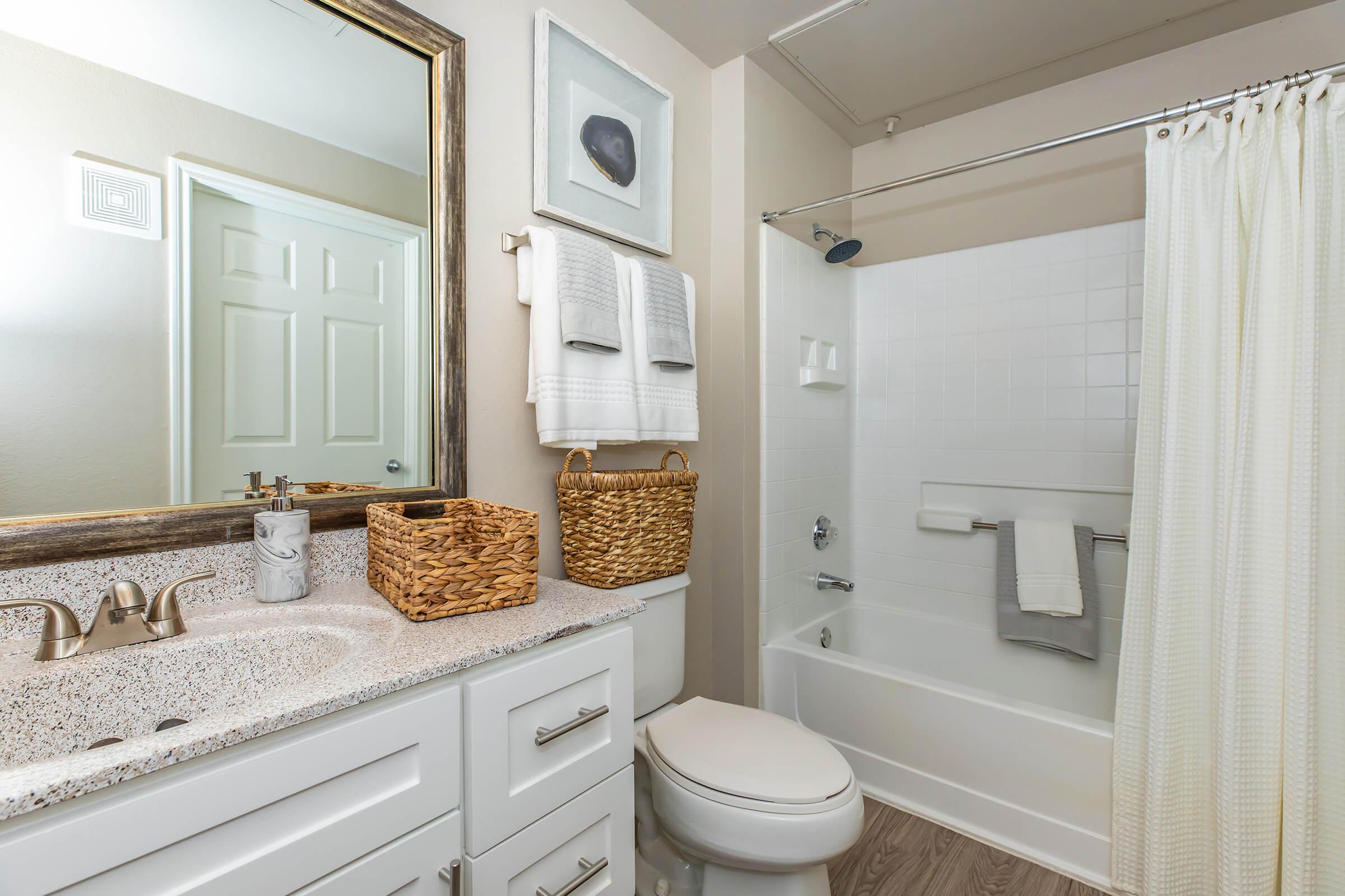 a bathroom with a white shower curtain