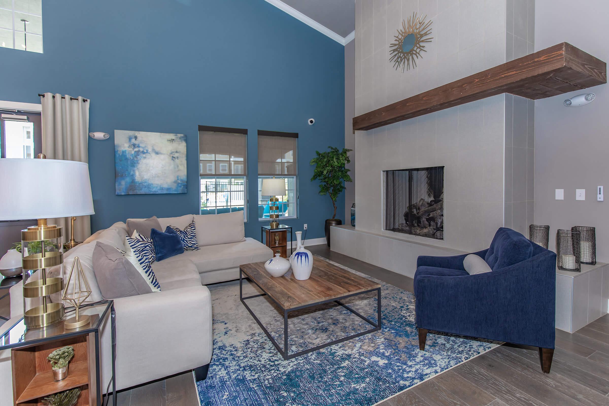 a living room filled with furniture and a large window