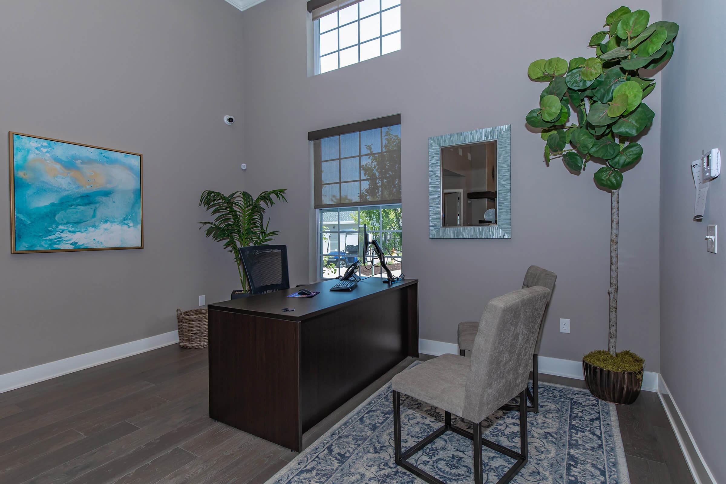 a living room filled with furniture and a large window