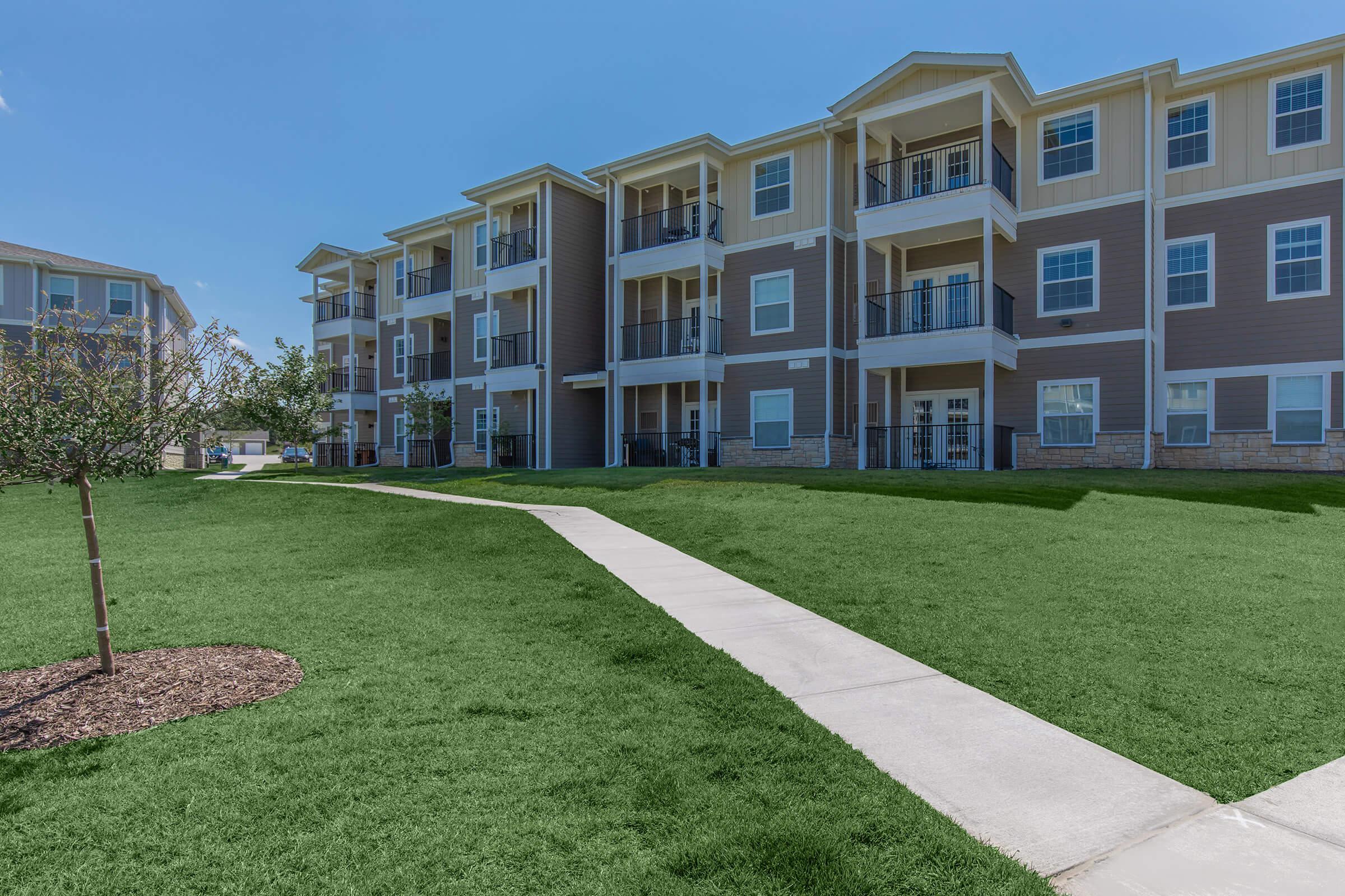 a large lawn in front of a building