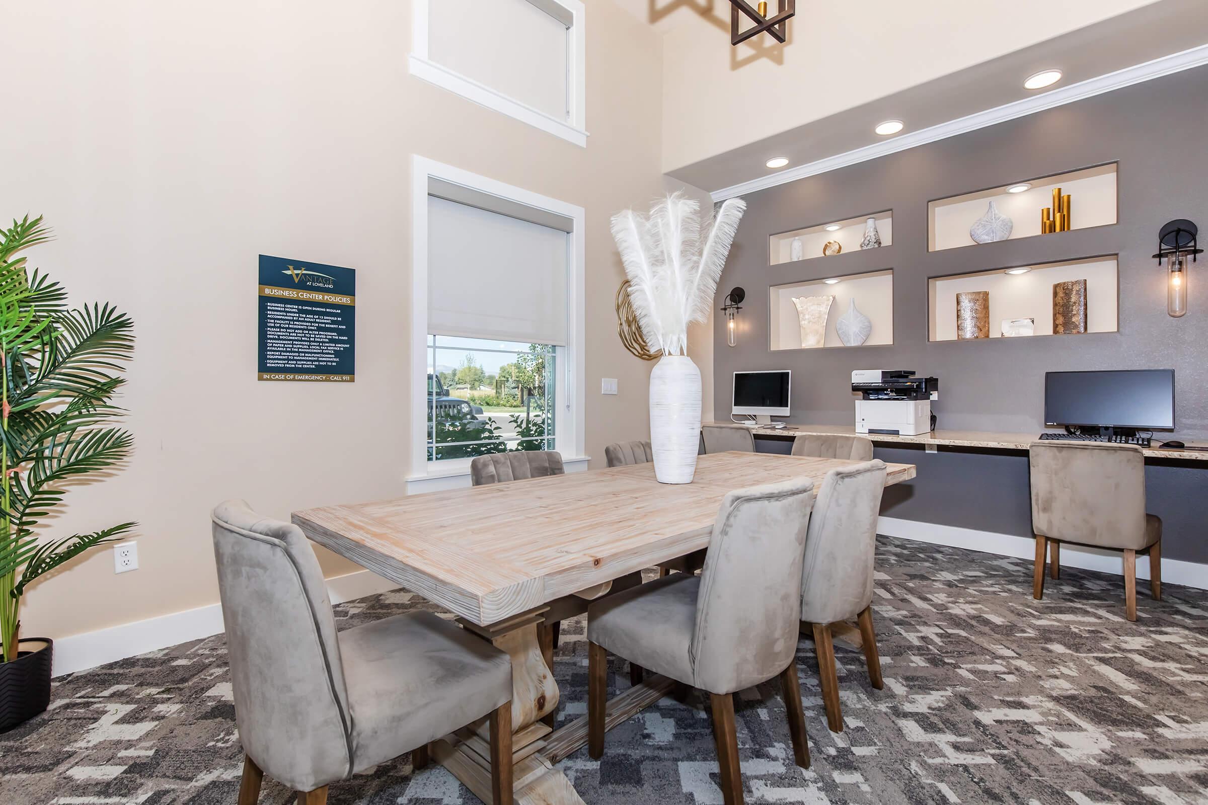 a living room filled with furniture and a table