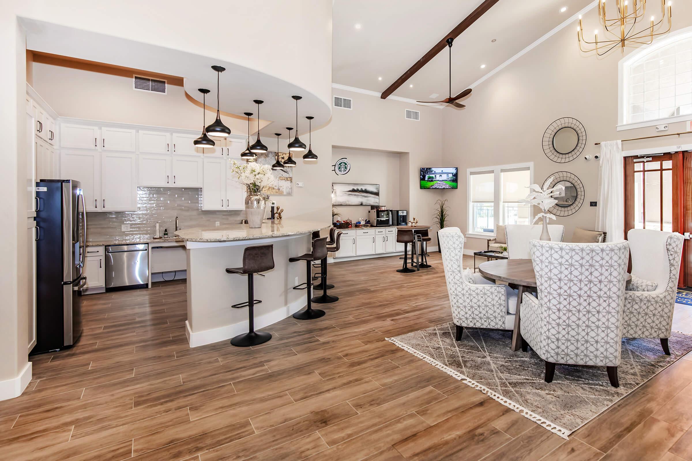 a room filled with furniture on top of a wooden floor