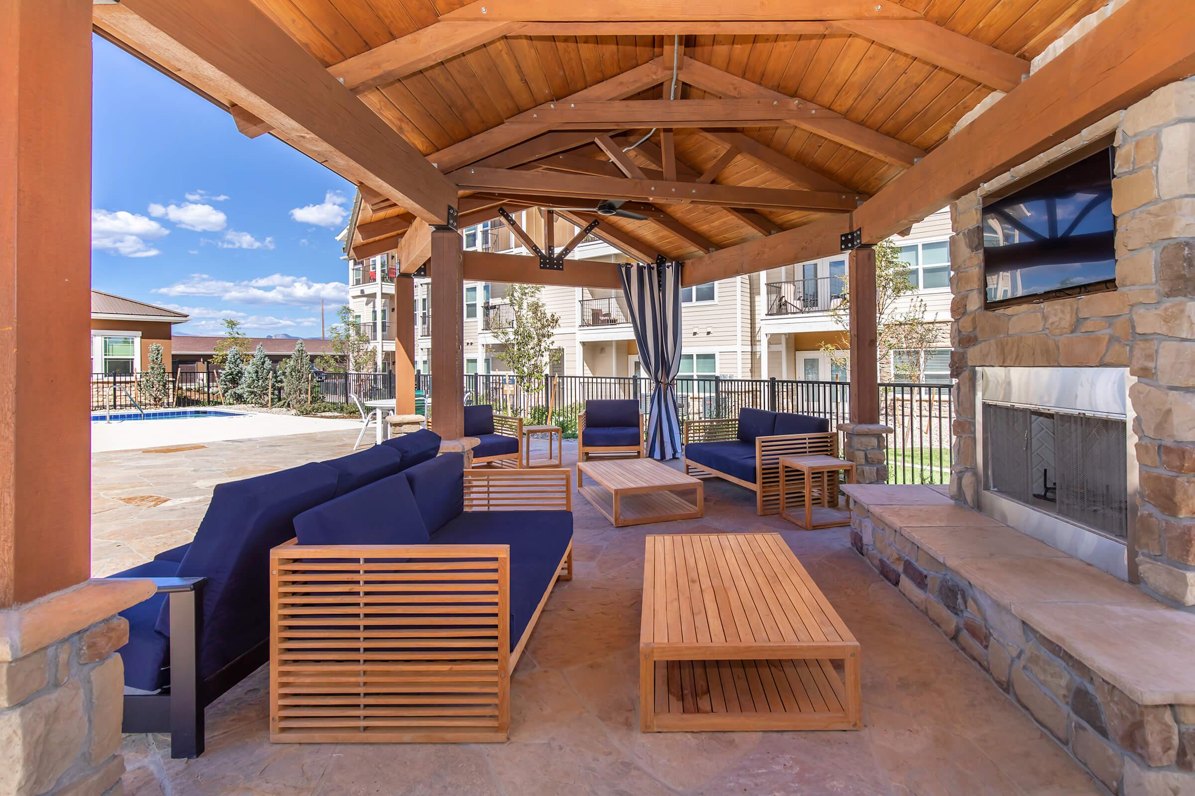 a wooden bench in front of a building