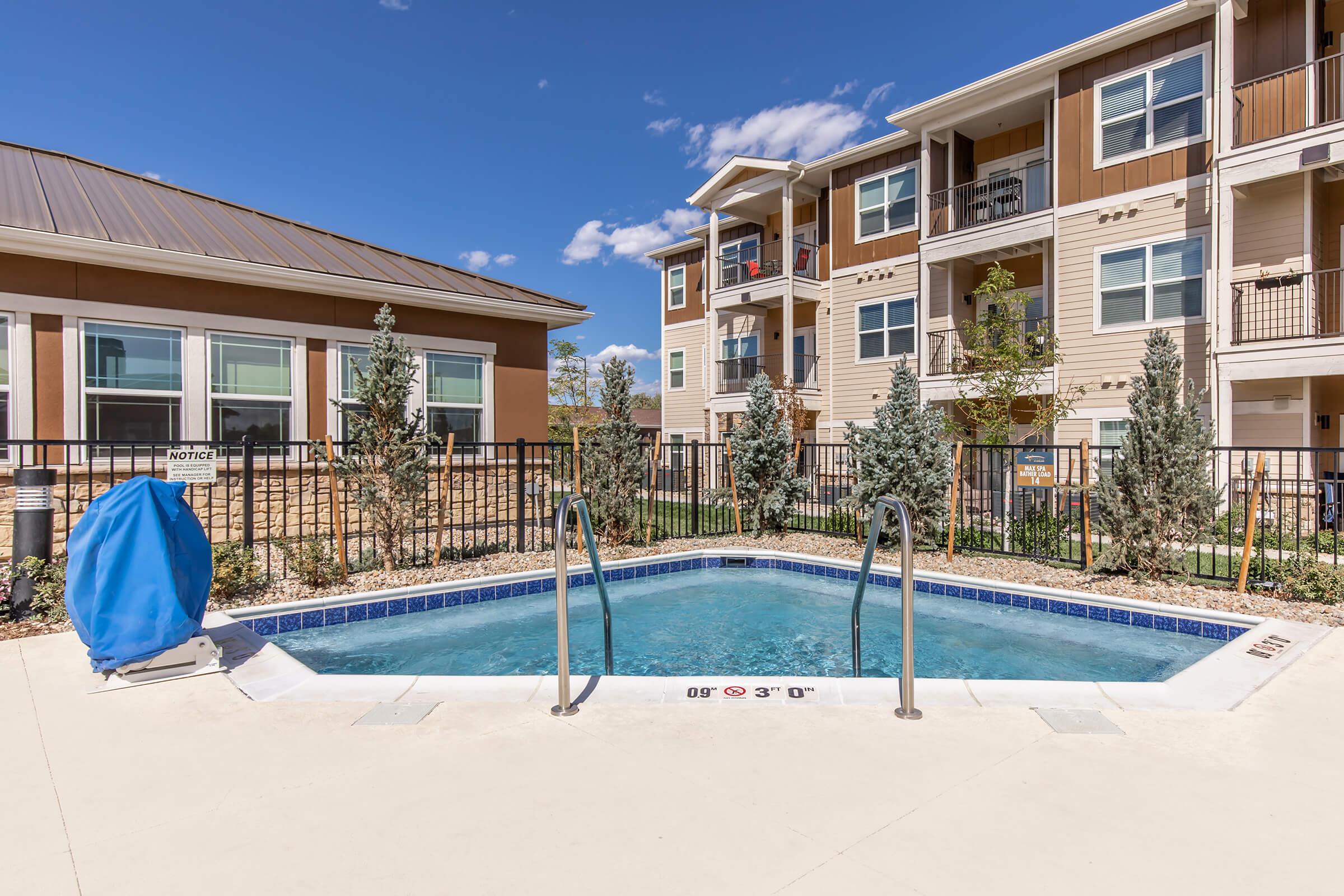 a large pool of water in front of a building