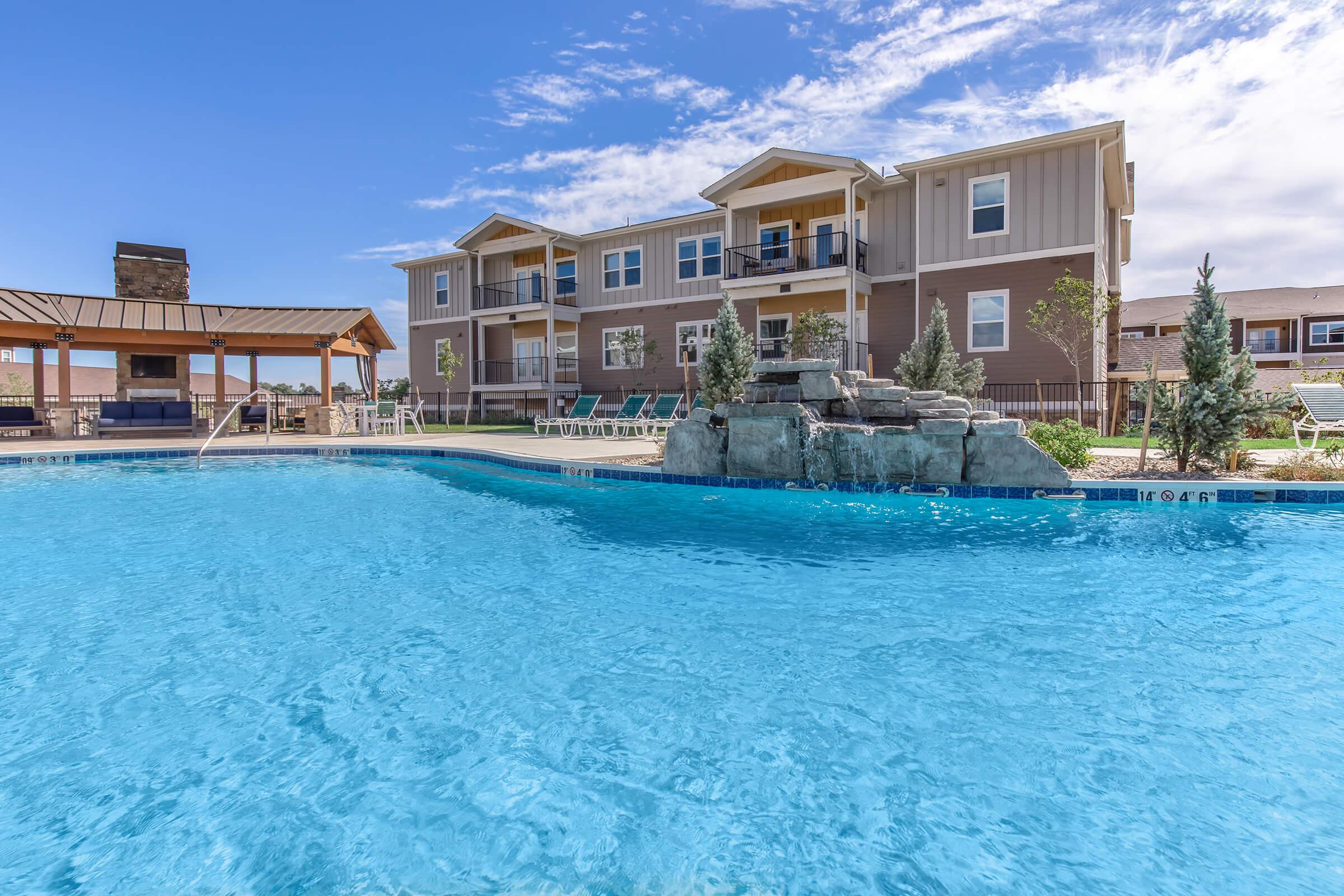 a large pool of water in front of a building