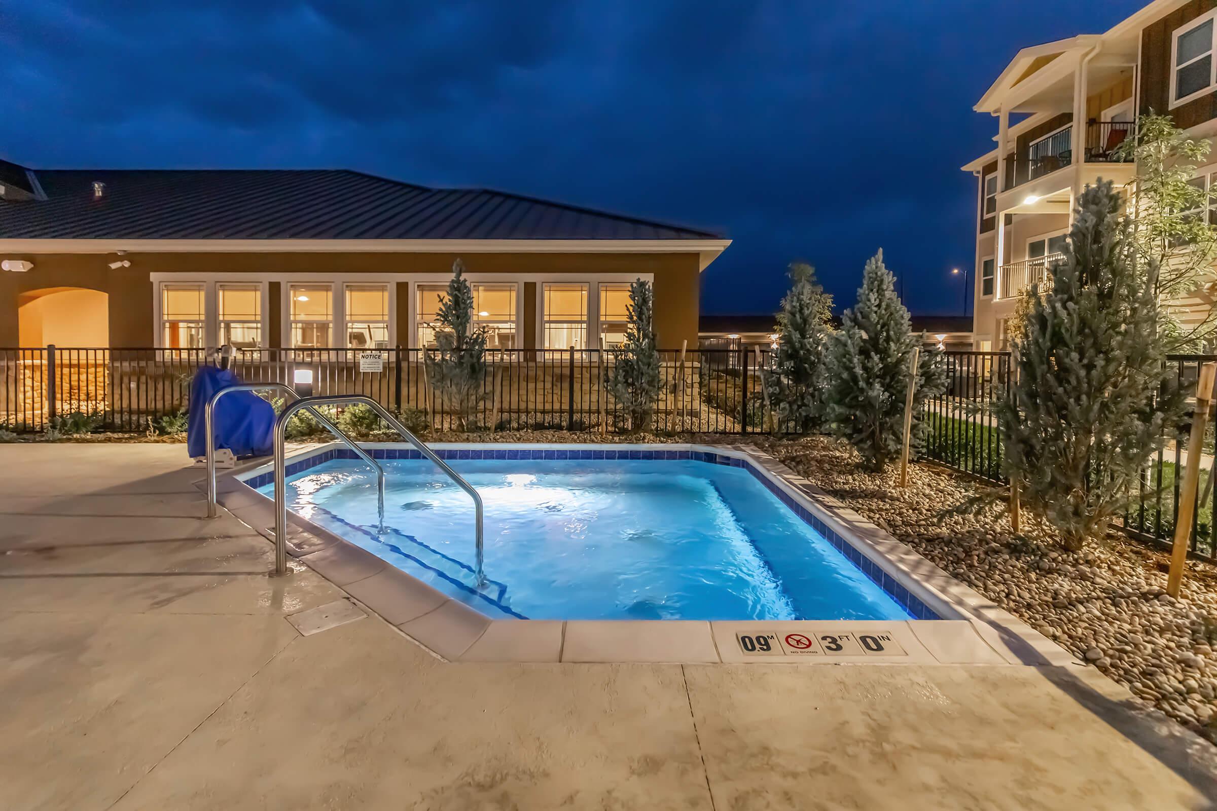 a pool in front of a building