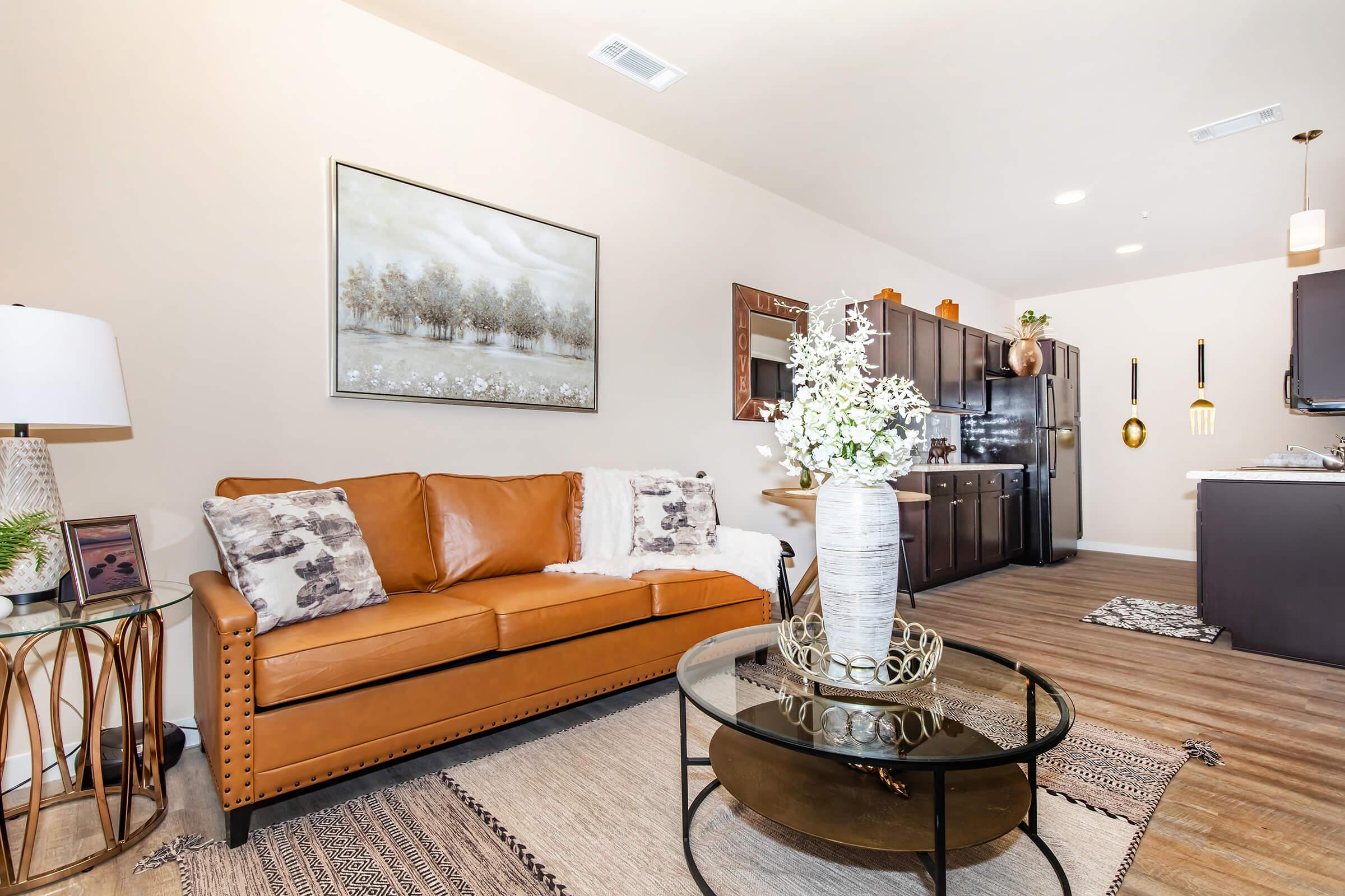 a living room filled with furniture and a flat screen tv