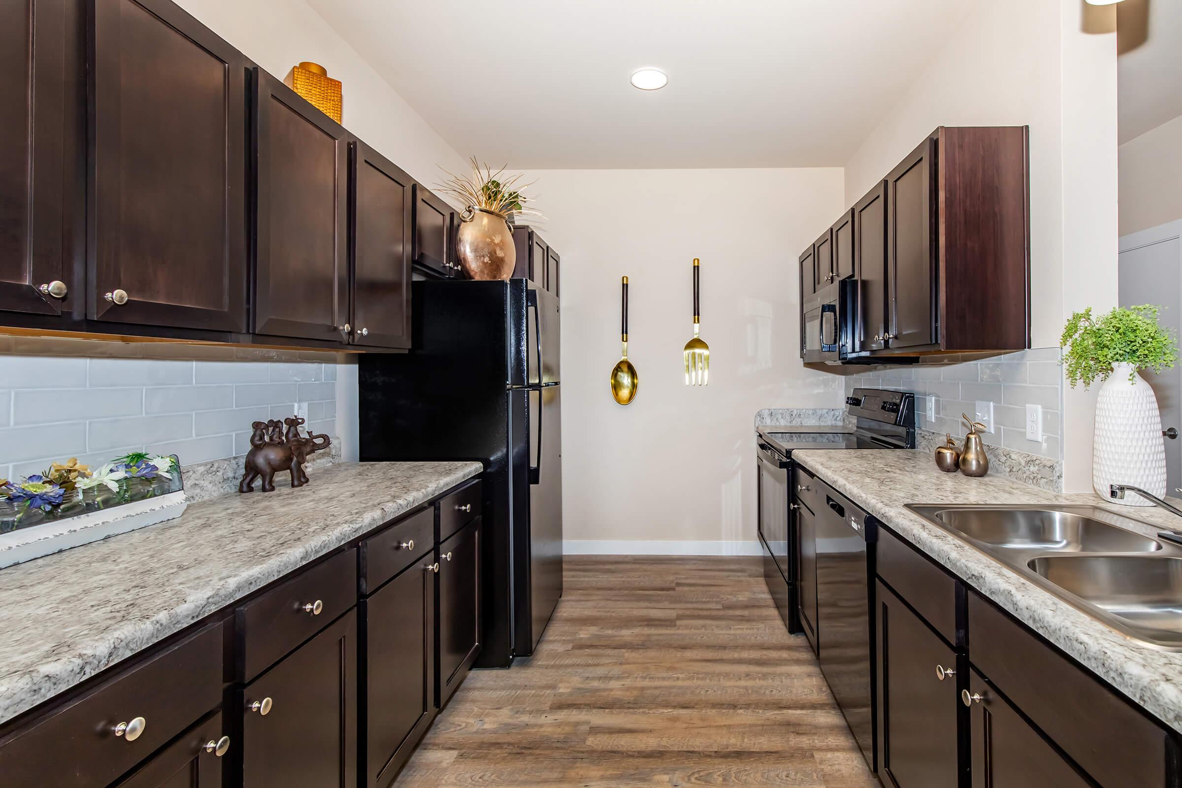 a large kitchen with stainless steel appliances