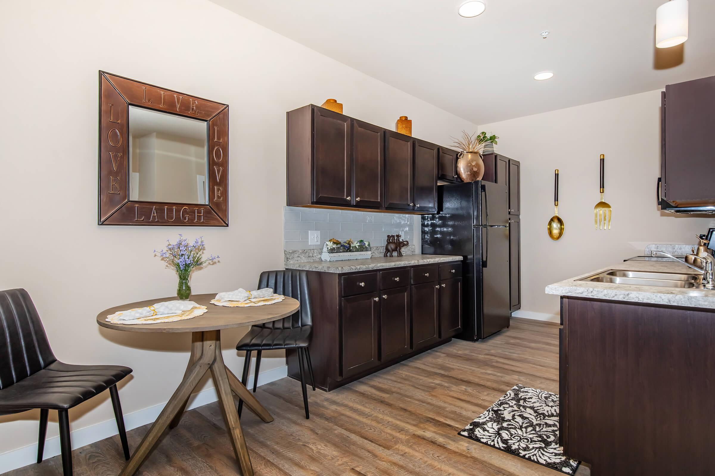 a room filled with furniture and a large mirror