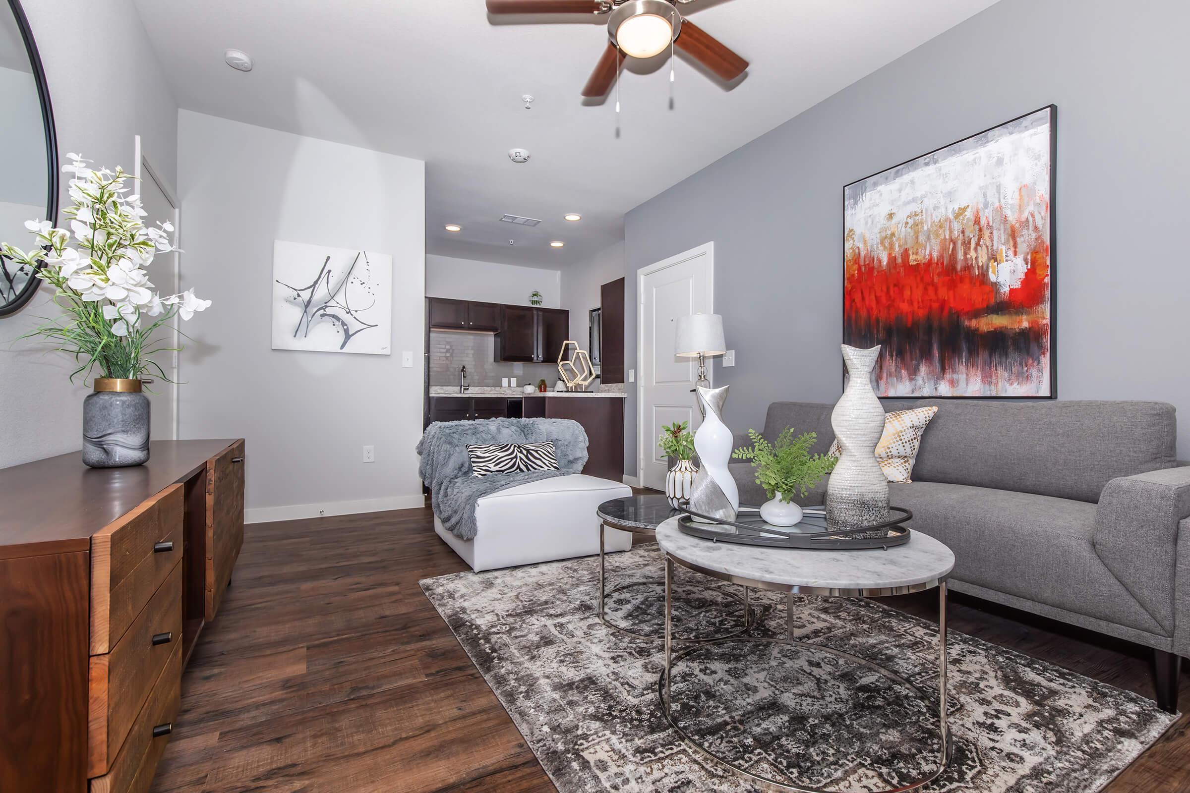 a living room filled with furniture and a fireplace