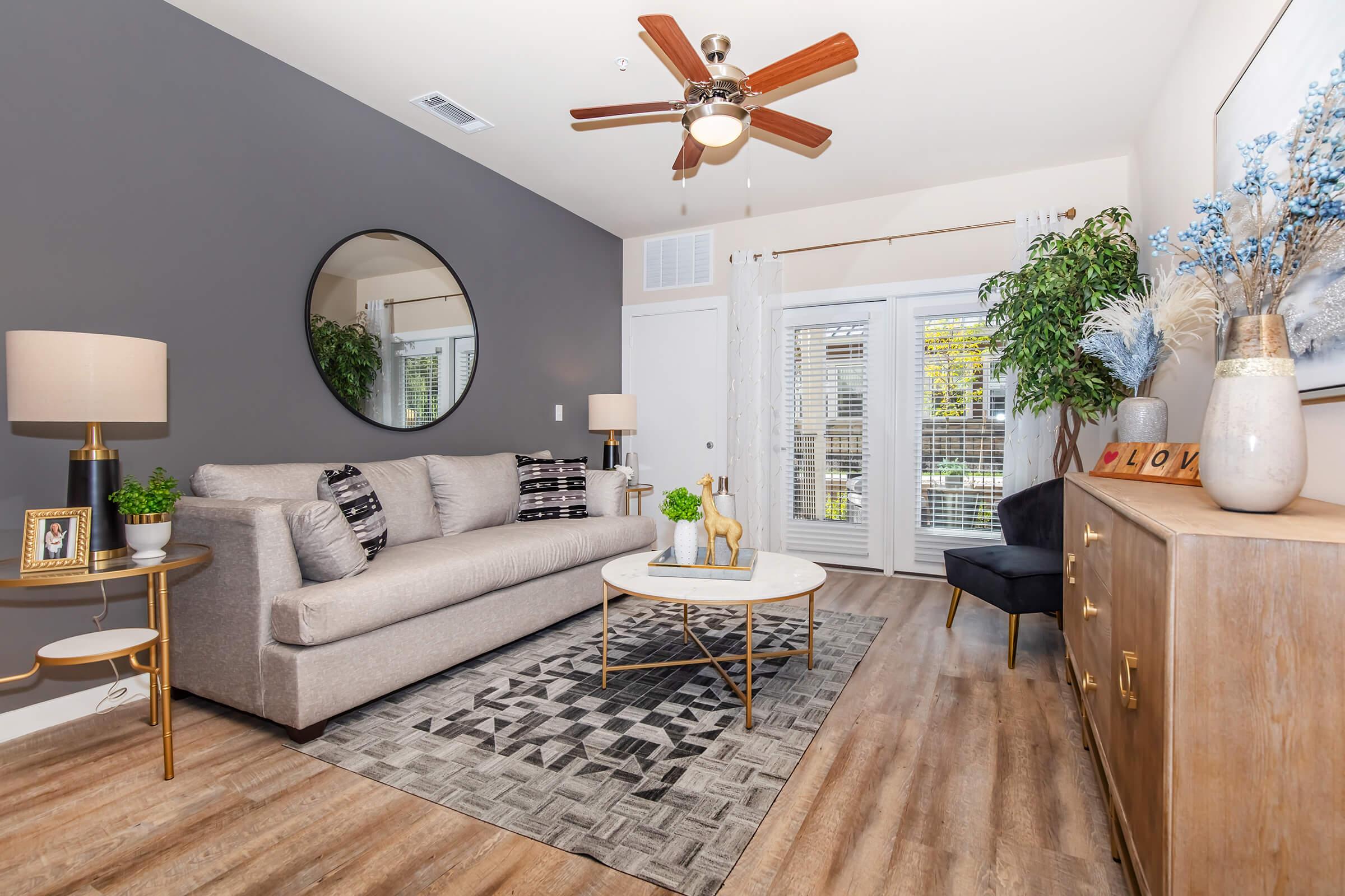 a living room filled with furniture and a fire place